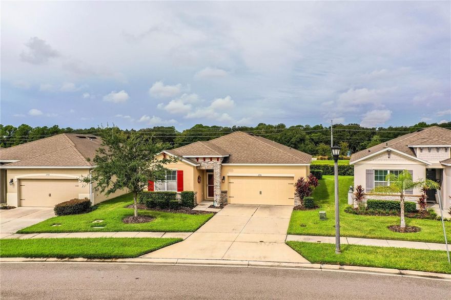 Welcome to 2778 Canyon Crest Drive, located in the gated 55+ community of Heritage Landings in desirable South Lakeland. Built by D.R. Horton in 2017, this well-maintained home offers a versatile bonus room that can easily serve as a home office, den, hobby room, or potential third bedroom, plus a dedicated laundry room and 2-car garage.

Designed with both comfort and functionality in mind, the open-concept floor plan features a spacious kitchen complete with granite countertops, stainless steel appliances, a large center island with seating, and a walk-in pantry. The kitchen flows seamlessly into the living and dining areas, creating an ideal space for everyday living and entertaining.

The spacious primary suite serves as a private retreat, featuring dual vanities, a walk-in shower, and two generous walk-in closets. Guests will appreciate the split-bedroom layout that provides additional privacy and comfort.

Step outside to the screened lanai and enjoy peaceful pond views with no rear neighbors, creating the perfect setting for morning coffee, evening relaxation, or entertaining friends and family. An irrigation system helps maintain the landscaping, while lawn maintenance and pest control are included, allowing for truly low-maintenance living.

Residents of Heritage Landings enjoy an active Florida lifestyle with access to a resort-style swimming pool, pickleball courts, clubhouse, fitness center, and a variety of community activities. The gated section of the community also includes lawn maintenance, providing additional convenience and peace of mind.

Ideally located near the Polk Parkway, shopping, dining, medical facilities, and major employment centers, this home offers convenient access to Tampa, Orlando, and Florida's renowned attractions and Gulf Coast beaches. Don't miss your opportunity to own this beautiful home in one of South Lakeland's premier active adult communities!