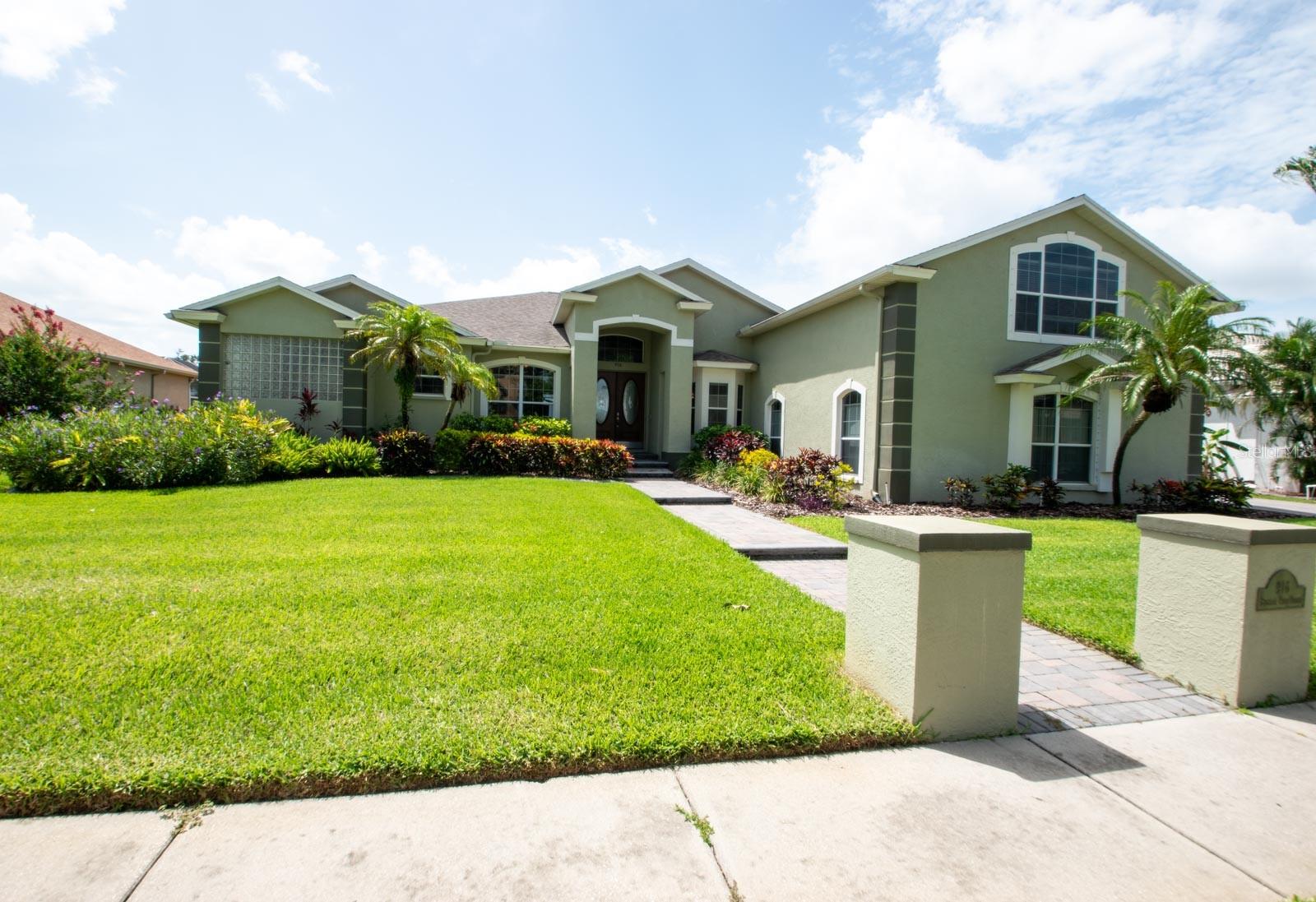Welcome to this spacious and beautifully maintained 4-bedroom, 3.5-bath home with 3,511 square feet of living space, located in the desirable Golf & Sea Village of Apollo Beach—a true hidden gem in older Apollo Beach! Nestled on a generous .29acre lot, this home offers lush landscaping, a long & wide paver driveway, and a charming paver walkway leading to the grand double-door front entry! Built in 2001, the home includes a 3-car “side-load” garage, newer 6-year-old shingle roof, and thoughtful updates both inside and out! Enjoy Florida living at its finest with your private pool and gas-heated spa, surrounded by newly installed paver decking (2024)! The rebuilt heater (2024) and the new pool pump motor (2023) add peace of mind, while the half bath and outdoor shower on the lanai offer added convenience! The backyard is completely fenced, with tranquil views of green space and a serene pond! The home is elevated above FEMA flood levels (elevation certificate available), with ZERO flooding or damage history, providing a low flood insurance premium! The irrigation system is on a well for even more added savings! Inside, you'll find thoughtful design touches throughout! From decorative tile inlays to arched pass-throughs, art niches, high ceilings, and a central vacuum system! The formal dining features new luxury vinyl plank flooring and a stylish chandelier! A dedicated office (with closet) has double full lite French doors, and also features that new LVP flooring! The spacious family room includes newer luxury carpeting, a pass-through to the kitchen, and four stacking hiding sliding doors that fully open to the lanai! Perfect for entertaining & a seamless flow of space! Your kitchen is a chef’s dream with rich wood cabinetry, granite countertops, an island, breakfast bar, stainless appliances, a closet pantry, and gorgeous glass tile backsplash! Adjacent dinette overlooks the pool through a seamless glass window! The unique “entertainment” room features ceramic tile flooring, two stacking hiding sliders to pool, a granite-topped 9ft wet bar with beverage fridge, and a pool table setup that conveys with the sale! The generous primary suite includes luxury carpet, an extended sitting area with an electric fireplace, double decorative French doors to the lanai/pool, dual walk-in closets, and a beautifully appointed ensuite bath! This resort like bath features a relaxing garden tub, separate sink vanities, granite counters, and an expansive walk-in shower with dual heads! Bedroom #2 has newer luxury carpet and shares a full bath (with dual access) with Bedroom #3! Bedroom #3 is versatile! Previously used as a home veterinary space & office! It's partially divided, has a large walk-in closet, and an exterior private entrance! So ideal for a home office or professional studio! Or, you can convert this fairly easily back to a bedroom! Upstairs, Bedroom #4 includes luxury carpet, an extended sitting area as well, a big walk-in closet, and an ensuite full bath! This could make for a great bonus room, or a private guest or in-law suite! Additional perks include an ARLO security doorbell with exterior security cameras, hurricane panels, gutters and downspouts, and attic storage! Apollo Beach offers shopping, restaurants, marinas, parks, a racquet & tennis club, medical facilities, and a scenic nature preserve! Floorplan is available for review! This home truly combines space, comfort, versatility, and lifestyle! Schedule your tour today!