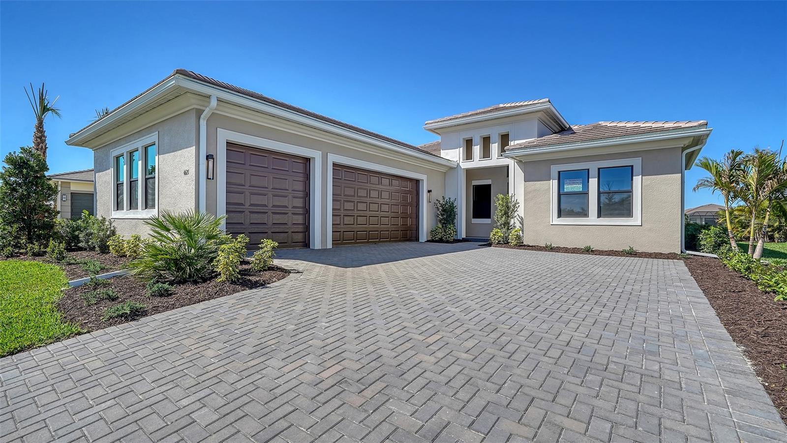 ***NEW CONSTRUCTION*** This well-appointed Monet plan is one of a kind with all the bells and whistles. This home has a 3-car garage with impact glass throughout. It's tall ceilings and open concept makes this home perfect for entertaining. The casual dining area offers large windows overlooking the sunset lake view, so every meal is enjoyed with a waterfront view. The primary suite also includes a large walk-in closet, and en-suite bathroom with frameless glass walk-in shower, dual vanities with make-up area, private water closet. Guests will find comfort in two large en-suite guest bedrooms along with a study, convenient powder bathroom, and laundry room with cabinetry.