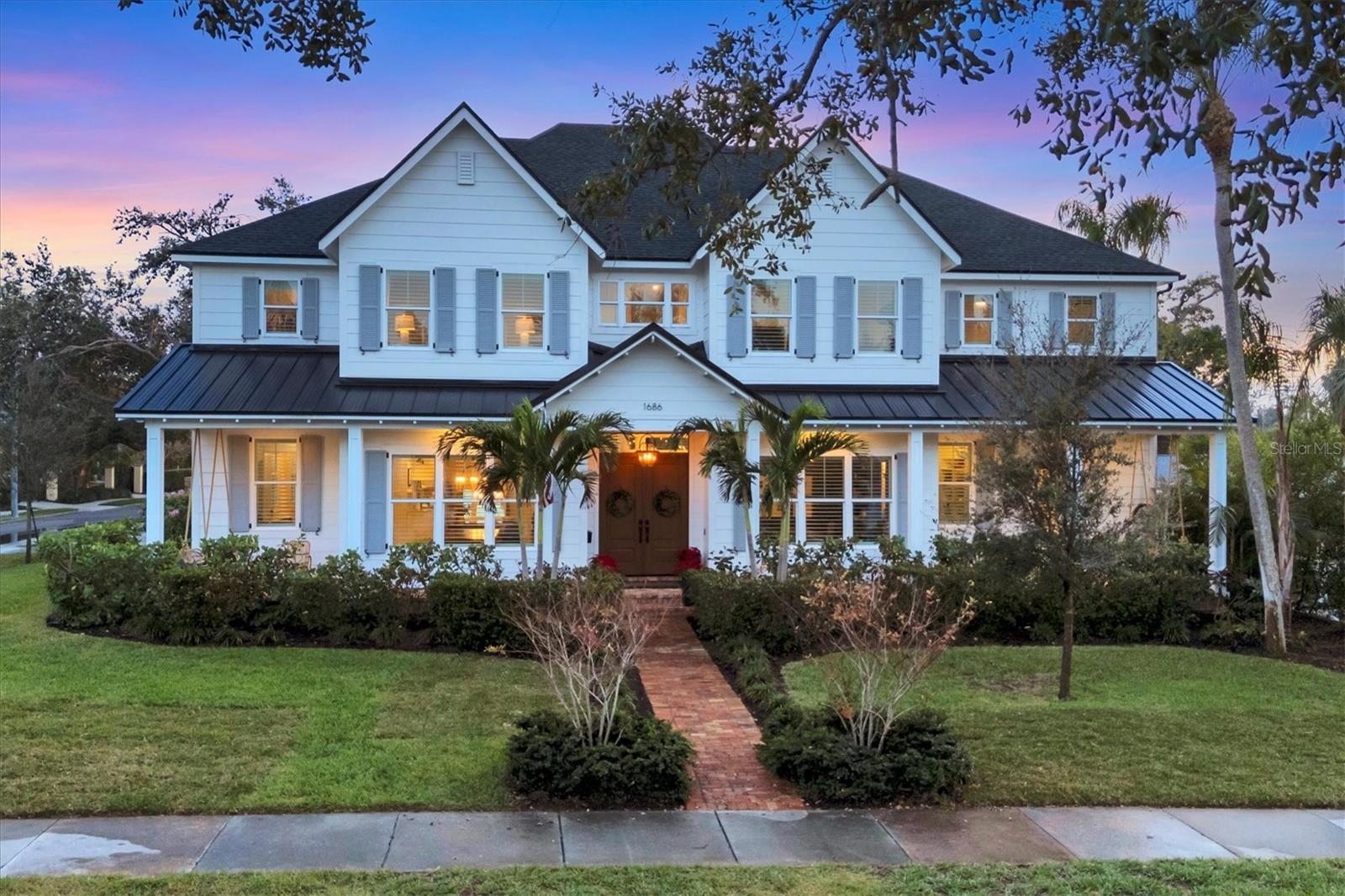 Welcome to this stunning 2021-built home in one of Sarasota’s most iconic and picturesque historic neighborhoods, Cherokee Park. Offering luxurious living with thoughtful design, this spacious residence of over 6000 square feet features a desirable first-floor primary suite with a decadent bathroom with soaking tub, oversized marble shower, and access to the covered porch for your morning coffee. The gourmet kitchen is equipped with Wolf and Subzero appliances, marble countertops, a walk-in pantry, oversized island for food prep or casual dining, and sweeping views of the pool and lush backyard. The family room is centrally located for optimal entertaining and boasts a gas fireplace, marble detail, and custom built-ins. The sophisticated den offers custom cabinetry and is ideal for a home office or a sitting room. Upstairs, you'll find four additional bedrooms, each offering ample space and walk-in closet storage, complemented by three full bathrooms. An oversized bonus room with wet bar and an open loft space offer additional living spaces on the second floor. Walk to the third floor for a finished attic space, perfect for additional storage or even more living space. The first floor laundry room boasts a custom mudroom with shoe cubbies and a built-in desk, conveniently located off the four-car garage. The private in-law suite includes a kitchenette, separate laundry, and elevator access for added comfort and independence. This home features beautiful oak flooring throughout, adding warmth and elegance to every room. Impeccable attention to detail is evident in every corner and the rooms are filled with abundant natural light. Enjoy quiet evenings on the back porch overlooking the heated pool and fenced yard with newly installed and maintenance-free turf grass. This house remained dry and with no damage following the hurricanes. Perfect for multigenerational living or hosting guests, this home combines modern elegance with practicality. Make this your own-Seller is willing to customize this home to suit your needs. Co-listing agent is the owner.