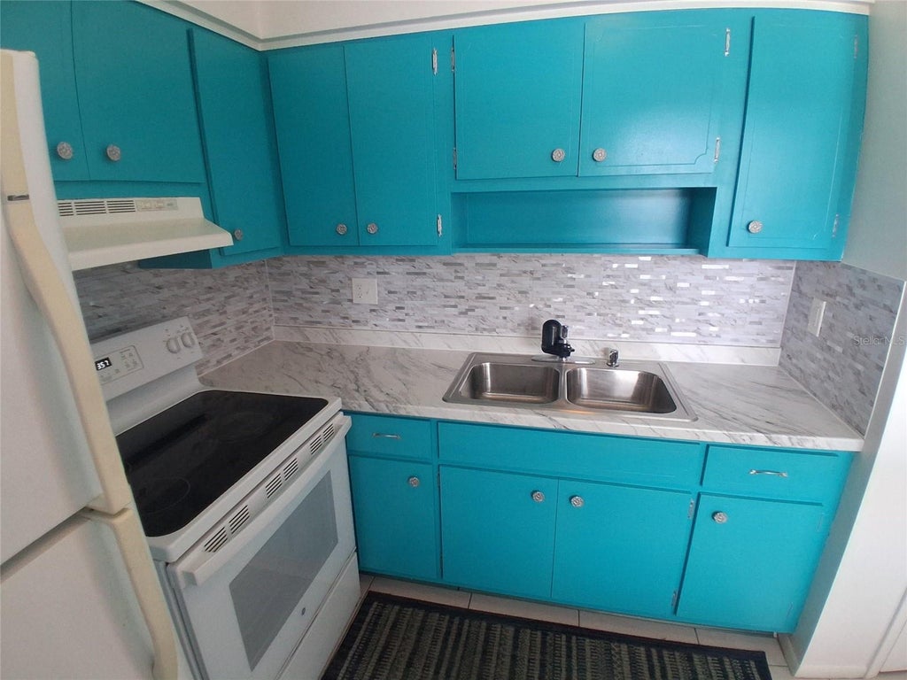 Photo of 125 Portree Drive, Dunedin, FL 34698 (MLS # TB8529769)