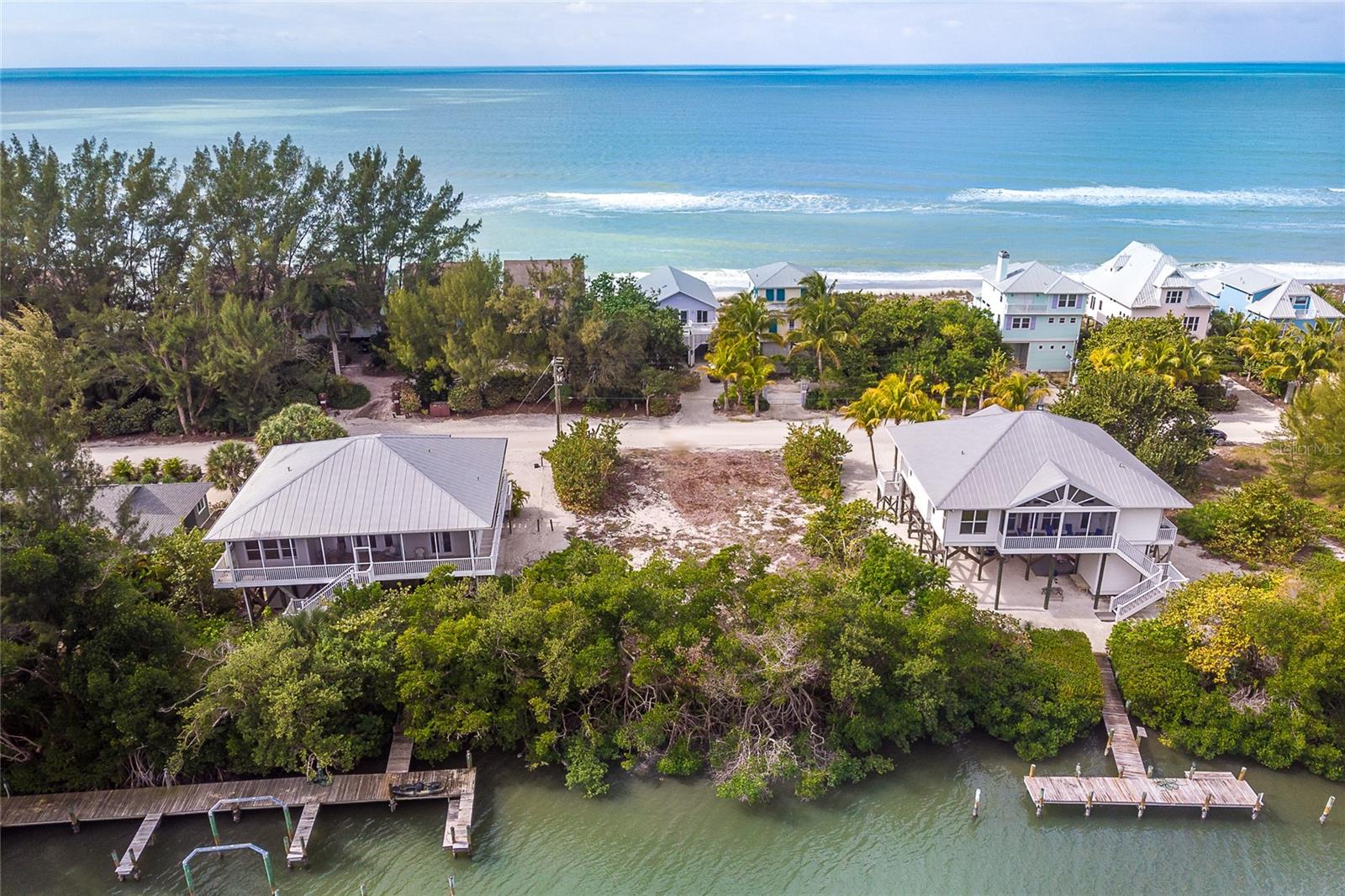 One of the few buildable lots in Colony Don Pedro on Don Pedro-Knight-Palm Island. Accessible via private boat or a 4 minute car passenger ride. Ferry runs continuously throughout the day into the evening 7 days a week. The lot is located on Bocilla Lagoon across the sand road from the Gulf With 7 miles of uncrowded, unspoiled beaches. This barrier island is situated between Ft. Myers/Naples to the south and Sarasota/Tampa to the north. You can build your own dock or use the community boat docks. Amenities include a swimming pool on the Gulf and tennis court. A survey is available but would need updating. Two sets of house plan drawings are available as well. A septic system for this property is installed at 222 S Gulf Blvd and will be shared with 2 other properties. Secure your piece of island paradise now to build your dream home!!!!