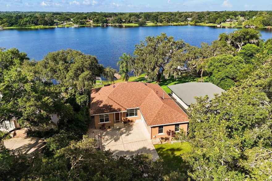 Location takes on a whole new meaning with this exceptional LAKEFRONT HOME. Perfectly positioned to capture 94 acres of PANORAMIC VIEWS of SKIABLE Lake Rose from nearly every room, this beautifully updated and move-in ready residence offers both tranquility and convenience. Privately nestled at the end of a LONG DRIVEWAY in a quiet, NO-HOA neighborhood, this home offers rare seclusion with ample space for multi-generational living. Boasting 5 bedrooms, 4 full bathrooms, a private office, a spacious bonus room, 2 full kitchens and 2 laundry rooms, there’s room for everyone! If you are looking for an IN-LAW SUITE the private access to the downstairs makes it the perfect space! High ceilings on both levels—an uncommon feature—create an open, airy ambiance throughout. Thoughtful upgrades include: NEW Roof (2023) NEW Exterior Paint (2025) NEW Dishwasher (2025) NEW Gas Water Heater (2023) NEW Triple-Panel Sliding Glass Door (2025) Additional premium features include crown molding throughout, a COZY GAS FIREPLACE IN THE PRIMARY SUITE, a luxurious spa tub in the primary bathroom, central vacuum system, and a chef-inspired gourmet kitchen complete with a large center island, dual wall ovens, a 5-burner NATURAL GAS COOKTOP, and Custom Range Hood. Whether you're water skiing, fishing, kayaking, or simply relaxing and taking in the BREATHTAKING LAKE VIEWS, this home offers the perfect blend of privacy, luxury, and accessibility. While you may never want to leave the peaceful, private setting, you’ll appreciate being just minutes from the 408, offering seamless access to all of Orlando. Enjoy world-renowned attractions like Disney, Universal, and SeaWorld—all within a 30-minute drive. Orlando International Airport is just 20 minutes away, and the beaches of Florida’s east coast are within an hour. If you're seeking serene lakefront living just minutes from everything Orlando has to offer—this is the one!  Applicants must have good credit and rental history, with income at least three times the monthly rent. One-year minimum lease required.