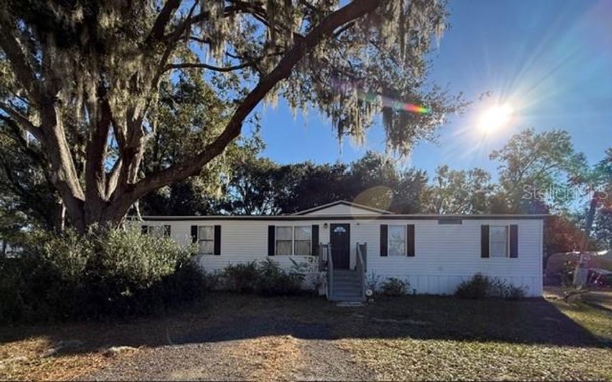 Short Sale. Welcome home to this beautifully renovated 4-bedroom property situated on nearly half an acre. Updated in 2023, the home features a brand-new kitchen with granite countertops, modern cabinetry, and stainless steel appliances. Luxury vinyl flooring flows throughout, complemented by a new roof, updated bathrooms, plumbing, water heater, and a new AC system—all completed in 2023. New ductwork was installed beneath the home in 2025. Enjoy a spacious, fully fenced backyard perfect for entertaining, pets, and family gatherings. Short sale