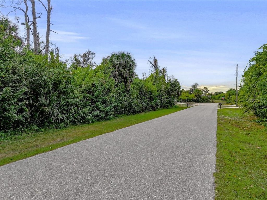 Photo of 11947 Helicon Avenue, Port Charlotte, FL 33981 (MLS # O6368797)