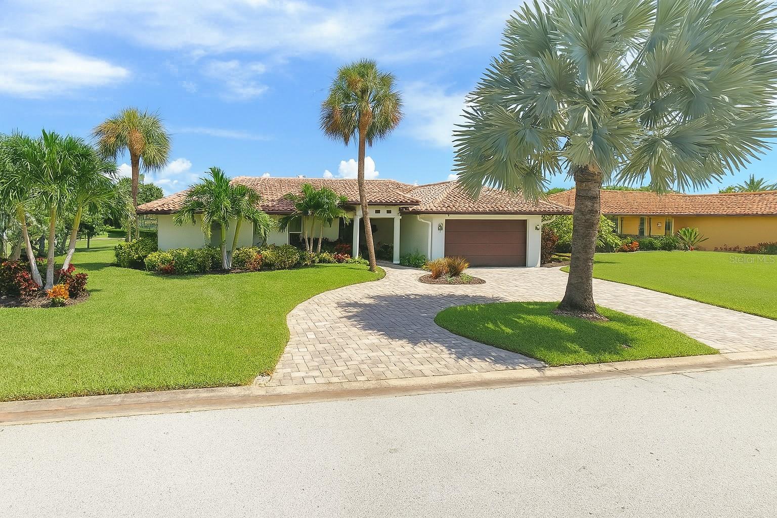 Highest and best offers to be submitted - Experience the charm of a Spanish Mediterranean-style home perfectly updated for modern living. Set along the water with a private boat dock and resort-style pool, this residence offers the ideal setting for boating, entertaining, and soaking in Florida’s year-round sunshine. Inside, elegant travertine floors flow throughout open living spaces, complemented by a refreshed kitchen with new cabinetry and fresh interior paint. A classic tile roof enhances the Mediterranean architecture while ensuring lasting durability. Enjoy peaceful mornings on the water, sunset views from your dock, and the relaxed elegance of a true Florida waterfront lifestyle.