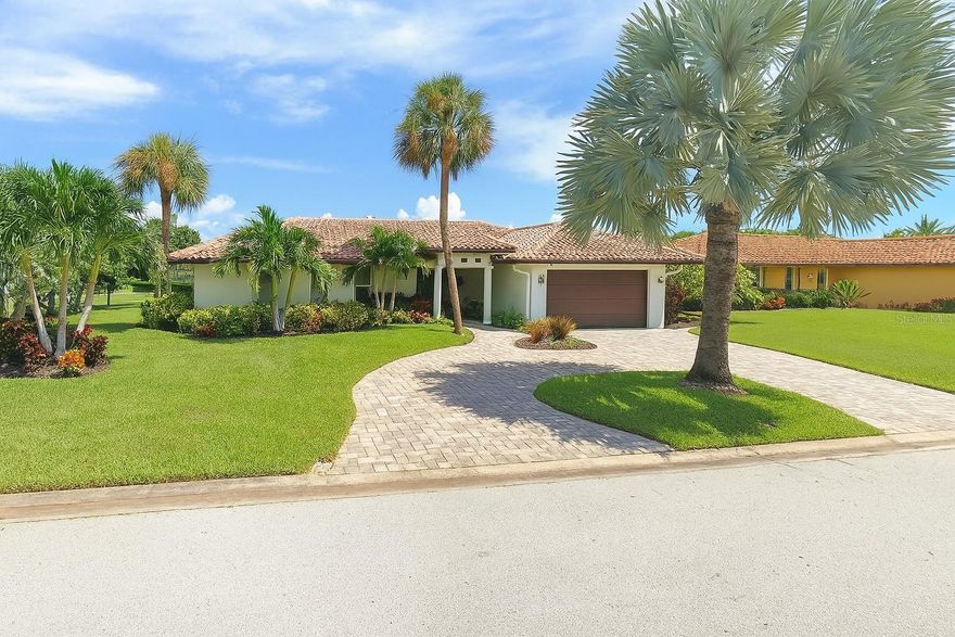 Highest and best offers to be submitted - Experience the charm of a Spanish Mediterranean-style home perfectly updated for modern living. Set along the water with a private boat dock and resort-style pool, this residence offers the ideal setting for boating, entertaining, and soaking in Florida’s year-round sunshine. Inside, elegant travertine floors flow throughout open living spaces, complemented by a refreshed kitchen with new cabinetry and fresh interior paint. A classic tile roof enhances the Mediterranean architecture while ensuring lasting durability. Enjoy peaceful mornings on the water, sunset views from your dock, and the relaxed elegance of a true Florida waterfront lifestyle.