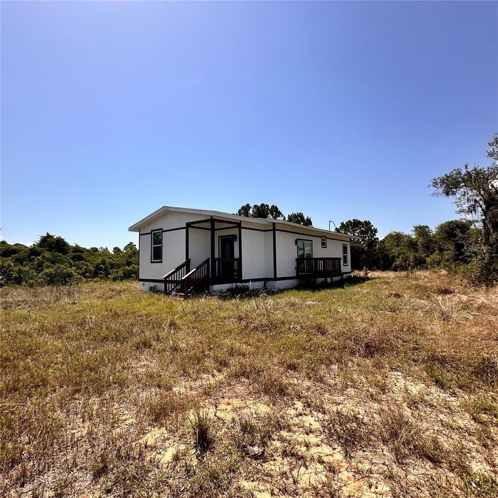 Photo of 601 Highlands Lake Drive, Lake Placid, FL 33852 (MLS # S5126997)