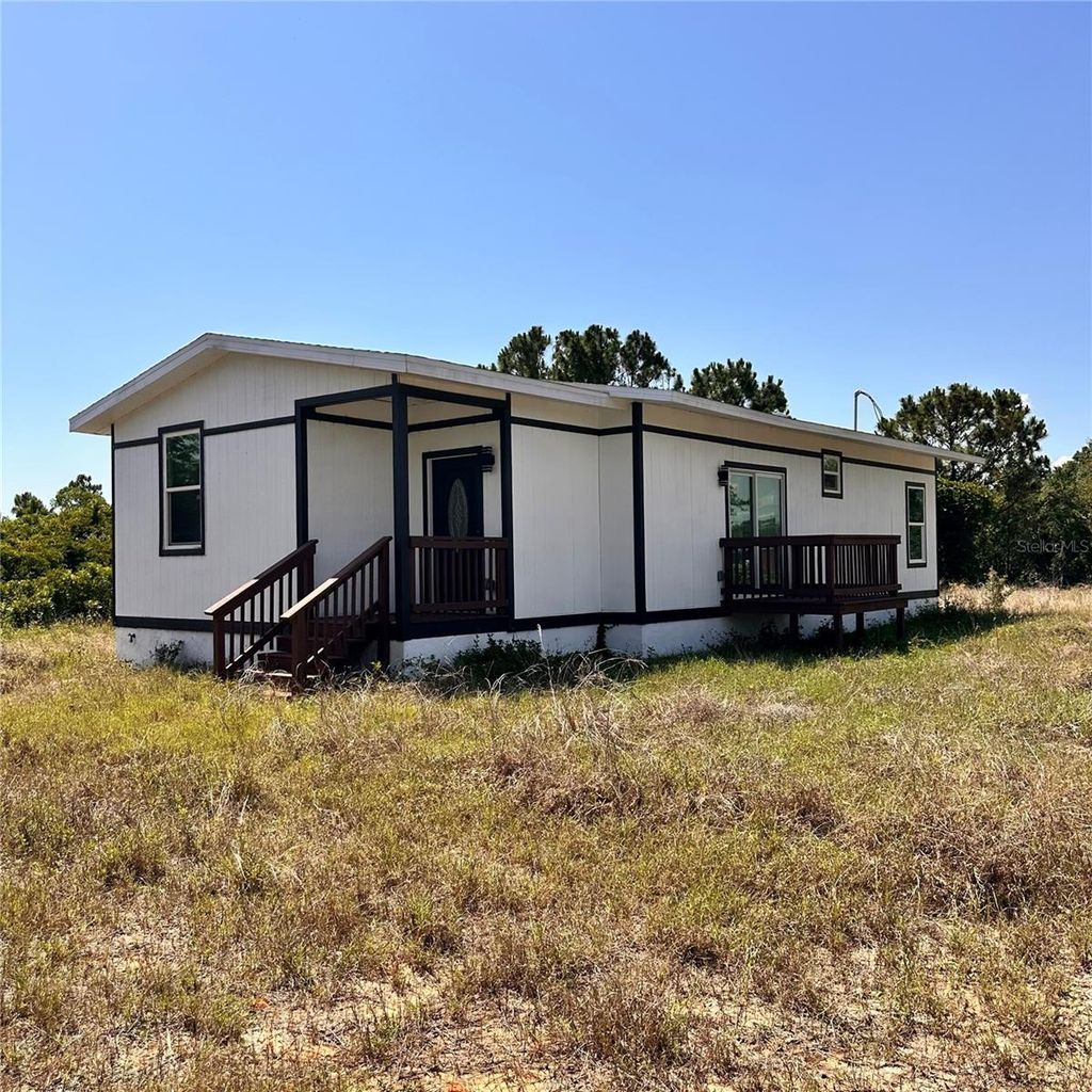 Photo of 601 Highlands Lake Drive, Lake Placid, FL 33852 (MLS # S5126997)