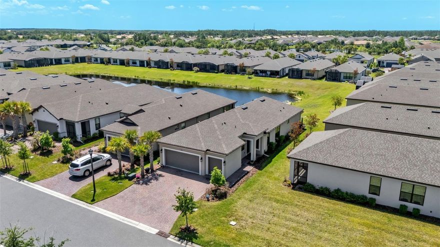 One or more photo(s) has been virtually staged. Don’t Miss This Upgraded Waterview Gem with Rare Golf Cart Garage! This beautifully appointed 2023 Allora model offers 2 bedrooms, 2 bathrooms, plus a versatile flex room. Perfect for a home office, den, or guest space, along with a 2-car garage and a highly sought-after golf cart garage, a premium feature not found in all homes. Ideally located near the Village Center, this home showcases serene water views, high ceilings, and taller interior doors that enhance the spacious, airy feel throughout.

Inside, you’ll find a bright open-concept layout with a spacious dining area and no carpet throughout, featuring ceramic wood-look tile for style and easy maintenance. The upgraded kitchen is designed to impress with a custom pantry, tile backsplash, breakfast bar, and pull-out double-level cabinetry, making everyday living and entertaining seamless.

The expansive great room opens to a screened, covered lanai overlooking the tranquil water, creating the perfect indoor-outdoor space. The primary suite also enjoys peaceful water views and features a spa-like en-suite bath with dual sinks, a large walk-in shower with built-in seating, and a custom-designed oversized walk-in closet.

The split-bedroom layout ensures privacy for guests, while the flex room adds valuable functionality to suit your lifestyle needs. Additional upgrades include built-in closets, gutters, and enhanced storage throughout, plus a laundry room with sink and cabinetry.

Step outside to an extended, fenced paver patio featuring pet-friendly artificial turf, a shaded Sunshade awning, and a dedicated pet area ideal for relaxing or entertaining.

Built in 2023, this home offers peace of mind with ROOF, HVAC, WATER HEATER, and APPLIANCES all 2023.

Located in the award-winning 55+ community of Solivita, residents enjoy access to world-class amenities including 14 heated pools, championship golf courses, pickleball and tennis courts, fitness centers, dining, and endless social opportunities. This is more than a home, it’s a lifestyle. Schedule your private showing today!