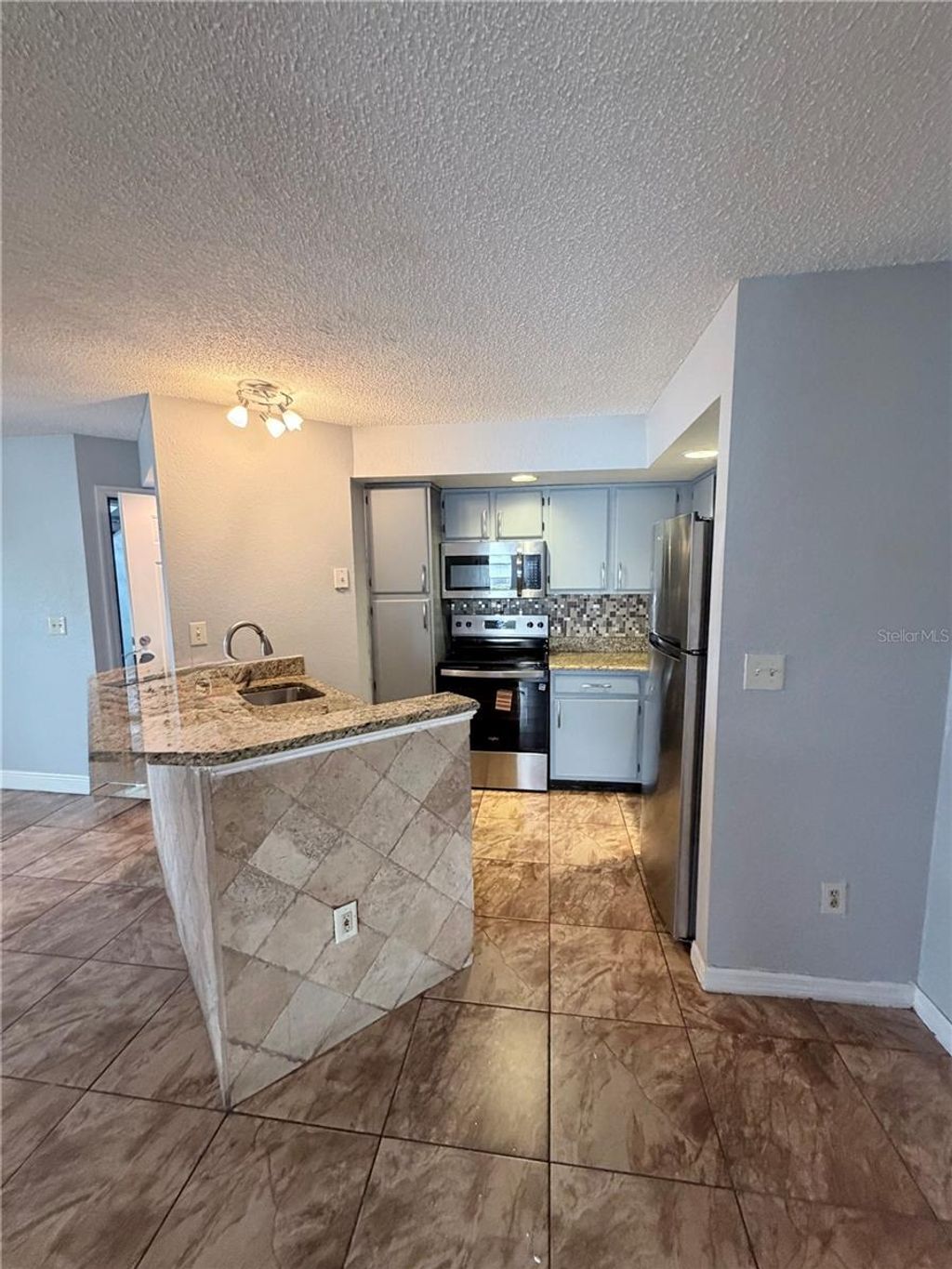Photo of 5713 Gatlin Avenue #218, Orlando, FL 32822 (MLS # S5146092)