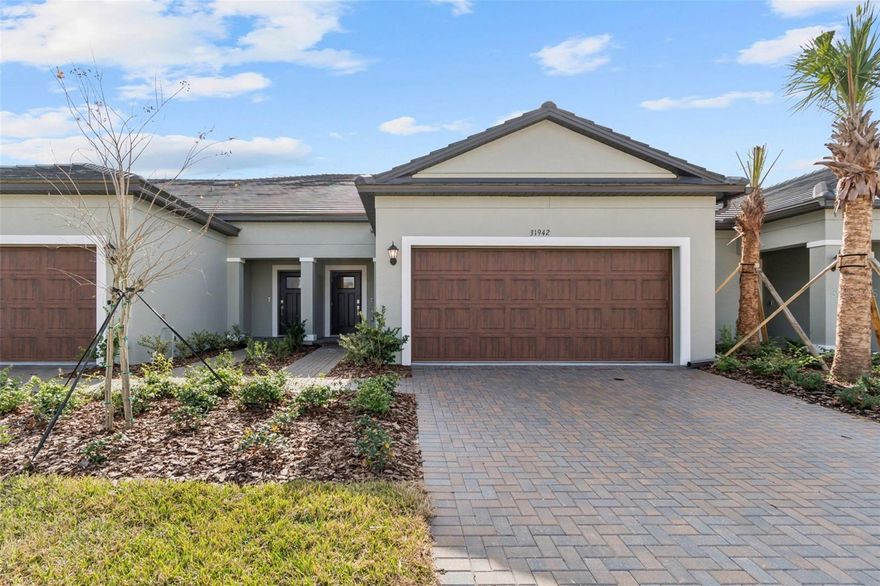Welcome to the resort-style living Mirada Active Adult 55+ community, located in beautiful San Antonio Florida in the greater Tampa Bay Area. This brand-new home built in Dec 2025 is available for Lease Now! Featuring 2 bedrooms, 2 and a half baths an open-concept floor plan perfect for both everyday comfort and entertaining. The heart of the home boasts a modern kitchen featuring white quartz countertops, brand new stainless steel appliances, and stunning contemporary ceramic tile flooring that flows seamlessly throughout the main living areas. The Primary bedroom is on on the 1st floor, privately tucked away with conservation views, an en-suite bathroom with double vanities, quartz counters, walk in shower and a huge closet. On the second floor you will find the secondary bedroom with conservation views, a large loft which can be used a work space or game room, and another full size bathroom. The home is bright with plentiful natural light, there are no front or rear neighbors creating a peaceful and private setting. The laundry room  is also on the 1st floor next to the well appointed 1/2 bath with pedestal sink. A two car garage offers lots of room for your vehicles or extra storage. Mirada is a gated community that perfectly balances a serene atmosphere with a fun, social lifestyle. Residents enjoy exclusive access to the 15-acre Mirada Lagoon, a private clubhouse, bar, resort-style pool amenities, fitness center, community activities, tennis and pickleball courts, shuffleboard, and walking trails. Golf carts are welcome, making it easy to get around, and additional community features include a playground, dog park, and endless opportunities to stay active and connected. Publix food shopping is 5 mins away with close proximity to I75 and State Road 52 , access to restaurants, medical facilities, the Wiregrass Mall, the Grove, and about 35 mins from downtown Tampa. The Orlando parks are over an hour away. The perfect place where relaxation and recreation come together beautifully.