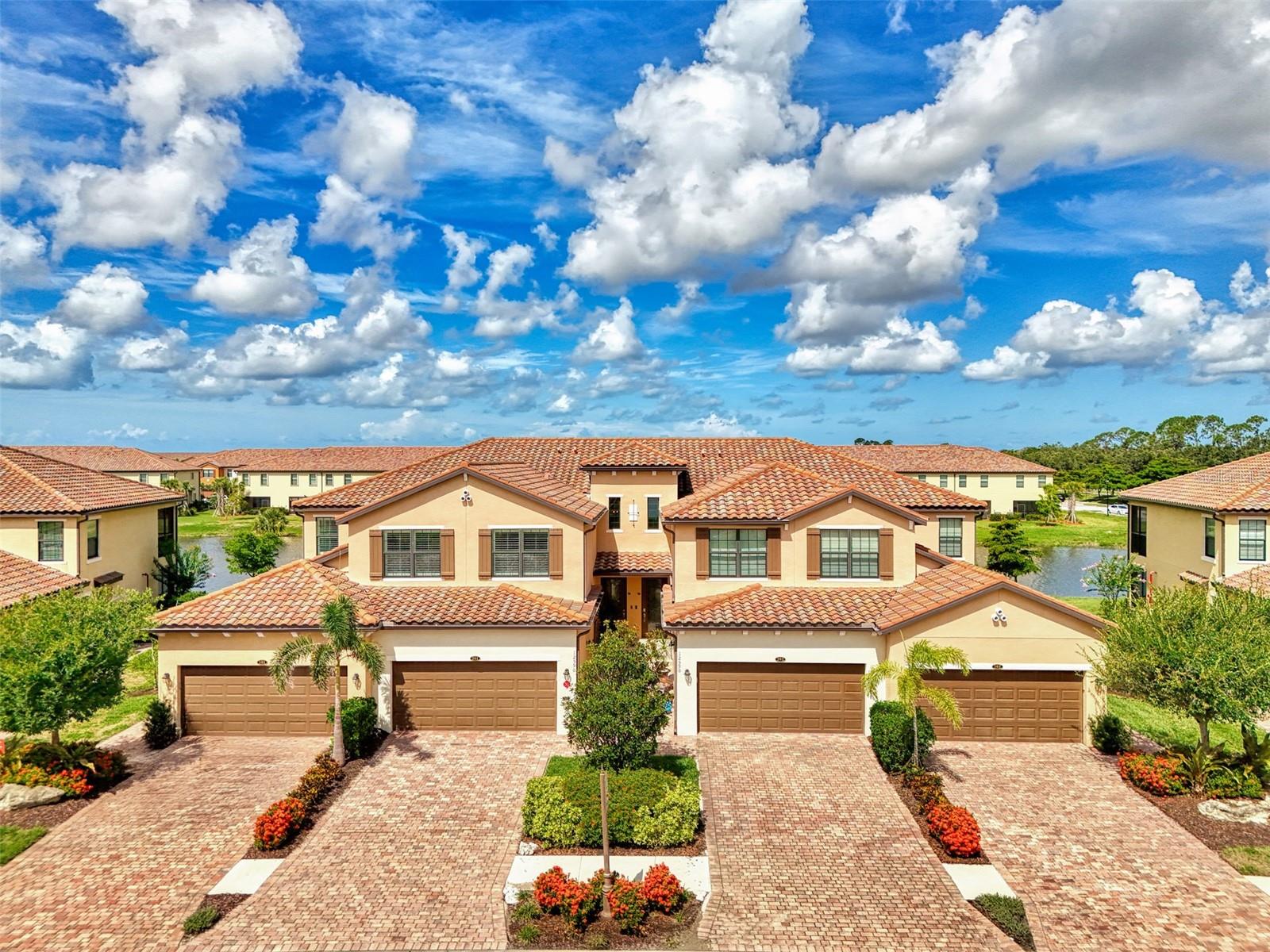 "Live like you're on Vacation" in this Modern Coach Home with Gorgeous Lake views. Hosting a split floor plan, for privacy, with 3 King-sized bedrooms, 2 baths plus an oversized garage-2 SUV's plus golf cart and Furnishings are available!
Custom upgrades include a Reclaimed Barnwood wall and inlayed Barnwood ceiling with trim in the great room, electric roll down blinds for the sliders. Extensive crown molding, Plantation shutters, large Porcelain tile...including the lanai, and freshly painted throughout in Designer colors.
Step into the Contemporary kitchen with classic 42-inch wood cabinets, One-of-a-Kind Quartz counters, Marble tile back splash, large Island bar with Elegant glass lighting, stainless steel appliances, and a very Spacious dining area.
The Primary suite boasts high ceilings with crown molding, trimmed ceilings, sitting area with sliders to the lanai, two large walk-in closets, a Roman glass walk-in shower, separate vanities with Quartz counters and ample cabinets for storage.
The Entire home has Impact Windows and Sliders. Fantastic open floor plan...Perfect for Family and Entertaining!
Guard Gated Gran Paradiso is known for their State-of-the-Art clubhouse with library, Resort type swimming pool, Extensive Fitness Center with instructed classes, Tennis, Pickleball, Community events and Social clubs to enjoy.
Perfect location to Wellen Park for shopping, restaurants, live entertainment, and The Atlanta Braves Ballpark. Short drive to Beautiful Gulf Coast Beaches.
Call today for your private appointment to view this exceptional home!