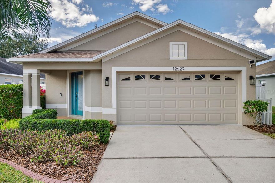 CUTE AS A BUTTON. METICULOUSLY MAINTAINED. GATED COMMUNITY WITH POOL. Welcome to 12629 White Bluff Rd., a 3 bedroom, 2 bathroom, 2 car-garage home with eat-in kitchenette, den/study area, living room, enclosed sun porch and perfectly sized fully FENCED backyard. This CONCRETE BLOCK home includes major renovations and upgrades. 2020 - Kitchen updates include cabinet refacing, granite countertops, new sink & faucet and garbage disposal. Primary bathroom upgraded with a zero-entry shower featuring new glass doors, double sinks, faucets, quartz countertop, vanity, lighting and towel/paper holders. Guest bathroom upgraded with new quartz countertop, vanity, lighting, and towel/paper holders. 2020 - Interior upgrades include WATER HEATER, ceiling fans with remotes, PLANK tile flooring in bedrooms, modern wall plates throughout and full INTERIOR PAINTING. 2021 – new window screens throughout the entire home installed. 2022 – ROOF REPLACEMENT & seamless GUTTERS installed. 2022- Full exterior of the home was PAINTED including new house numbering. 2023 – SPRINKLER SYSTEM was updated with the entire system inspected, repairs completed, and new heads installed. 2024 – HVAC system installed with a new thermostat controller. 2024 - St Augustine SOD INSTALLED front and back. Little details that enhance comfort and make a home feel complete are screened in lanai Florida room with four sliding windows and side door to the backyard, paved side yard area, decorative curbing with stylish landscaping, Duramax Tool Shed, kitchen skylight, exterior garage KEYPAD, Ring Solar Camera System covering the garage, porch, backyard, and side areas, security film on rear glass and decorative film on the front entry glass door. Please note, this home is located in a non-flood required area. The mailbox station is located right across the street. The Verandahs is a golf cart friendly community with a clubhouse featuring a kitchen and bathrooms, 24-hour fitness center, resort style pool with bathrooms, playground, and community activities, minutes from the Suncoast Parkway and a Publix shopping plaza. Survey & Video available upon request. Buy a Little Piece of Florida Now!