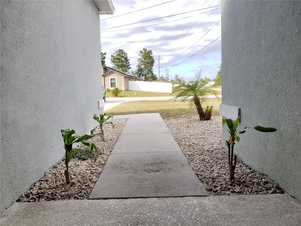 Photo of 100 Sweet Pea Court, Poinciana, FL 34759 (MLS # O6392529)