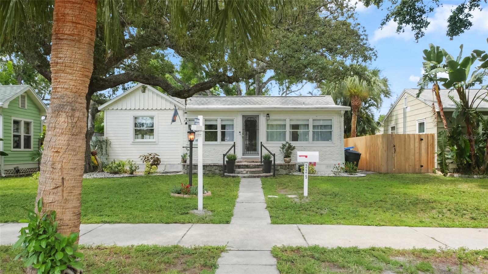 Welcome to this beautifully renovated bungalow located in the heart of one of St. Petersburg’s most coveted neighborhoods: Old Southeast. Nestled on a quiet brick lined street just four homes away from the waterfront at Lassing Park, this home offers the perfect blend of charm, convenience, and peace of mind. Enjoy water views of Tampa Bay from your front porch and breathtaking glimpses of the downtown skyline from your backyard—all while being HIGH AND DRY—NO FLOOD INSURANCE REQUIRED.
This thoughtfully updated 2-bedroom, 2-bathroom home includes 1,241 square feet of living space with a versatile bonus room perfect for a home office or creative studio. Renovated in 2023, the home features brand-new engineered hardwood flooring throughout, a designer kitchen with solid wood cabinets, 2-inch quartz countertops and backsplash, and new kitchen and laundry appliances.
Step outside onto the extended backyard deck, ideal for entertaining guests or enjoying a quiet evening under the stars. The backyard offers a peek at the downtown skyline and is the perfect spot to unwind. Additional features include a 2018 roof and an HVAC system also from 2018.
Located just over a mile from vibrant downtown St. Pete, you’ll enjoy easy access to award-winning restaurants, boutiques, museums, and nightlife—while still coming home to a peaceful, bayfront community. Wake up to sunrise walks or yoga by the water, watch windsurfers glide past from your front yard, and embrace the laid-back yet connected lifestyle that makes Old Southeast so special.
This is more than a home—it’s a lifestyle.