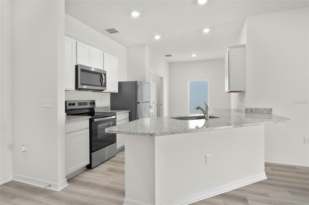 Photo of 13246 Tula Loop, Astatula, FL 34705 (MLS # TB8491028)