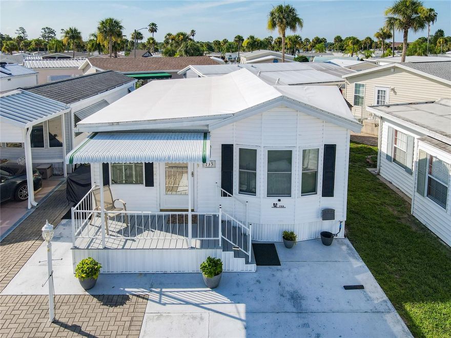 Welcoming curb appeal to this well maintained 2 bed, 1 bath, move in ready, ONE LEVEL home in the beautiful community of Outdoor Resorts!! Parking for 2 vehicles plus a golf cart.  Home features: NEW ROOF; NEW PLUMBING;  2 covered porches at both front and rear of the home; laminate & vinyl flooring throughout; stackable washer & dryer; smooth top stove; 2 door refrigerator; microwave hood. OODLES OF STORAGE!! Transferable Home Warranty. This wonderful resort offers a 24/7 guard gated front entrance and private access to a 179 acre lake - beautiful Lake Davenport. Outdoor Resorts offers amenities such as 2 heated swimming pools, boat dock, golf course & 9 hole putt-putt golf, tennis, pickleball, a two story clubhouse for entertainment during various seasonal events & so much more....The Association fee is only $691.00 PER QUARTER! which includes all your amenities, in addition to Cable TV, Community heated pools, Park Manager, Mowing, Sewer, Water and Trash! Come and enjoy this fantastic, affordable lifestyle! Please remember 55+, no VA or FHA, 1 pet rule. The park benefits from being close to medical facilities, restaurants & grocery stores. Don’t delay!! Put this home on your ‘must see list’ and ask to arrange a viewing today! ****  PS. Golf cart can convey with sale if Buyer is interested (needs new batteries) ****