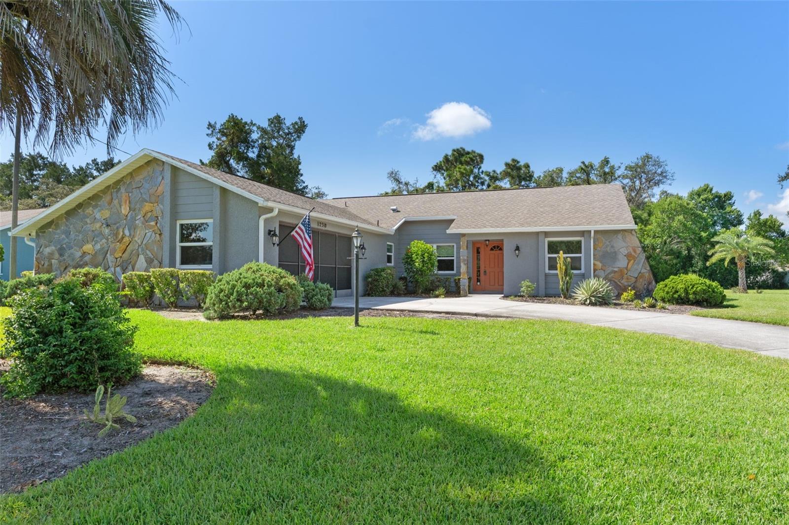 Meticulously Maintained POOL Home with Custom Outdoor Kitchen & Recent Upgrades! Come on over and check out your beautifully cared for 2-bedroom, 2-bathroom POOL home that blends comfort, functionality, and outdoor living in one perfect package. Located in a quiet neighborhood in the heart of Spring Hill, this home has been thoughtfully updated and is truly move in ready. Inside, you'll find a warm and welcoming layout featuring cathedral ceilings, new flooring, custom window blinds, and a cozy wood burning fireplace in the living room. The kitchen offers incredible refinished countertops, a breakfast bar, and plenty of cabinet space, perfect for casual meals or entertaining with family and guests. The primary bathroom has been tastefully upgraded, and both bedrooms are generously sized with plenty of natural light. Enjoy peace of mind with major updates already completed, including a 2020 roof, 2022 air conditioning system, and newer windows throughout. Outside, you'll find your crystal clear pool is complemented by an electric pool heater, making it usable year round. The screened in back patio is an entertainer's dream, featuring a massive custom outdoor kitchen complete with a built in grill, smoker, sink, and fridge perfect for gatherings or quiet evenings at home. Your lush green backyard also features a 2025 stand alone storage shed and a private well for irrigation, helping to keep your landscaping lush without added expense. This is a home that's been loved and it shows. Schedule your showing today and experience all the comfort and quality for yourself!
