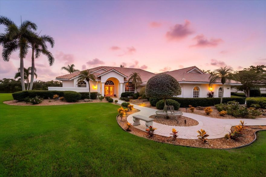 Find your sanctuary in a home where stunning lake views provide a peaceful backdrop for your day, and a championship golf course adds to the serene landscape. This exceptional residence is thoughtfully designed for both intimate moments and entertaining, offering a balance of quiet relaxation and social space. A private, spring-fed lake, which acts as a wildlife sanctuary, is the main event as soon as you step inside. You'll enjoy frequent sightings of local wildlife right from your covered lanai and custom pool area, a perfect spot for watching the sun set over the water. For an active day, the lake offers endless opportunities for kayaking, canoeing, and fishing. Inside, the home features modern upgrades like a beautifully updated kitchen and owner's suite bath, as well as new floor coverings throughout providing a seamless and cohesive look that ties the home's modern design together. The oversized 3-car garage offers a dedicated workshop for hobbies and projects. This home blends a tranquil country feel with unmatched convenience, set within a secure, gated community with 24-hour staffed security. A large park is conveniently located right across the street, offering a perfect spot for a daily walk. The community itself is situated on 350 acres of preserve and features the Ted McAnlis-designed championship course, recognized as one of Sarasota’s finest, with no required membership for homeowners. All this is just a short 15-minute drive from the world-famous Siesta Key Beach and the shopping and dining at UTC Mall.  This is your opportunity to have it all. Don't just imagine a life of tranquility—discover it for yourself.