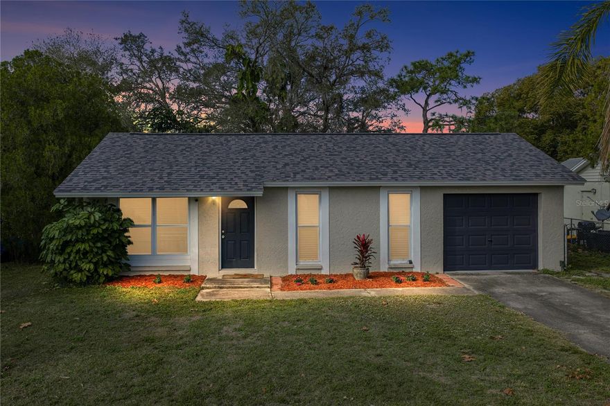 Set in a convenient and bustling New Port Richey location, this charming 2 bedroom, 1 bath, 1 car garage home presents an easy, comfortable layout along with valuable updates, including a 2023 roof and a fully privacy fenced backyard. Step inside to a space that immediately feels welcoming, where laminate flooring, vaulted ceilings, a handy storage closet, and open views to the dining area highlight the 13x13 living room and create a bright, functional gathering space. The galley-style kitchen flows easily from the living and dining areas and offers a full four-piece appliance package, with the added convenience of being located directly next to the laundry room and garage, making unloading groceries and everyday chores a breeze! The primary bedroom is thoughtfully split from the secondary bedroom for added privacy and features laminate flooring along with easy access to the full bathroom with a tub and shower combination. On the opposite side of the home, double doors lead into the second bedroom, currently used as a flexible second living space. Sliding glass doors open to the expansive backyard, creating a seamless connection to outdoor living. Outside, enjoy evenings on the back deck, gather around the fire pit, and take advantage of the storage shed, all within a fully fenced setting ideal for relaxation, pets, or playgrounds. This home offers a fantastic opportunity for first-time buyers or those looking to downsize while still enjoying outdoor space and a great location. Give us a call today to experience this charming New Port Richey home!