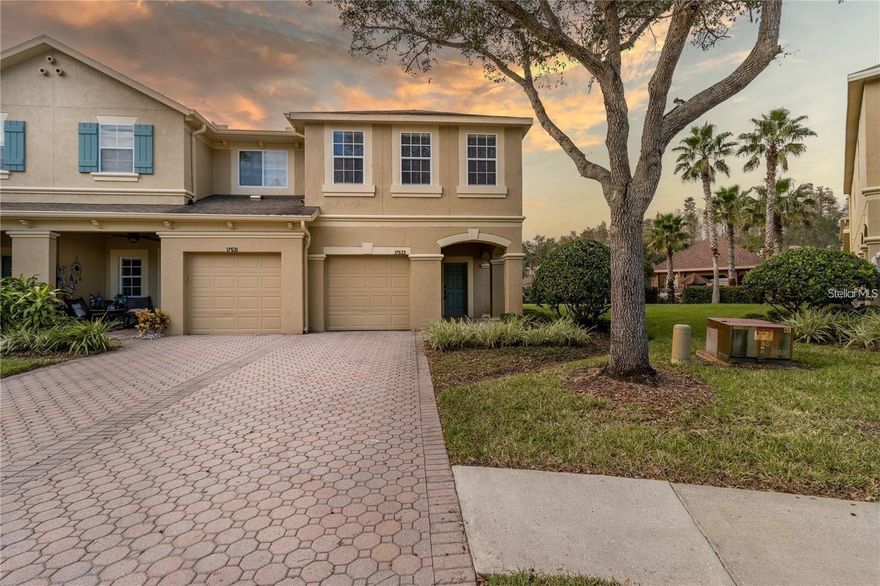 This maintained townhome in Ballantrae offers 3 bedrooms, 2.5 bathrooms, and 1,800 square feet of living space, plus a versatile upstairs loft, perfect as a den, home office, game room, or hobby space.

Upon entering, you'll find laminate and ceramic tile flooring throughout the home. The first floor features a spacious and bright living and dining area, an open-concept kitchen with a window overlooking that beautiful lake view, stainless steel appliances, a pantry, and a functional island, plus a half bathroom, ample storage under the stairs, and a one-car garage with a paved driveway for additional parking.

Relax in the sunroom overlooking the tranquil pond, the perfect place to enjoy those breathtaking Florida sunsets.

Upstairs, you'll find a spacious master suite with a walk-in closet and a large private bathroom with a soaking tub and separate shower. Two additional bedrooms and a full bathroom are separated by the loft, offering privacy and convenience. The laundry room is conveniently located upstairs, with ample space for hanging clothes. Recent improvements include a new air conditioner installed in 2020 for added peace of mind and energy efficiency.
Residents enjoy a variety of community amenities: a pool, playground, bike paths, tennis, volleyball, and basketball courts. Located near top-rated schools, major highways, restaurants, shopping, and entertainment options, this area is experiencing incredible growth.

Don't miss this move-in ready townhome with water views, low HOA dues, and a great value.