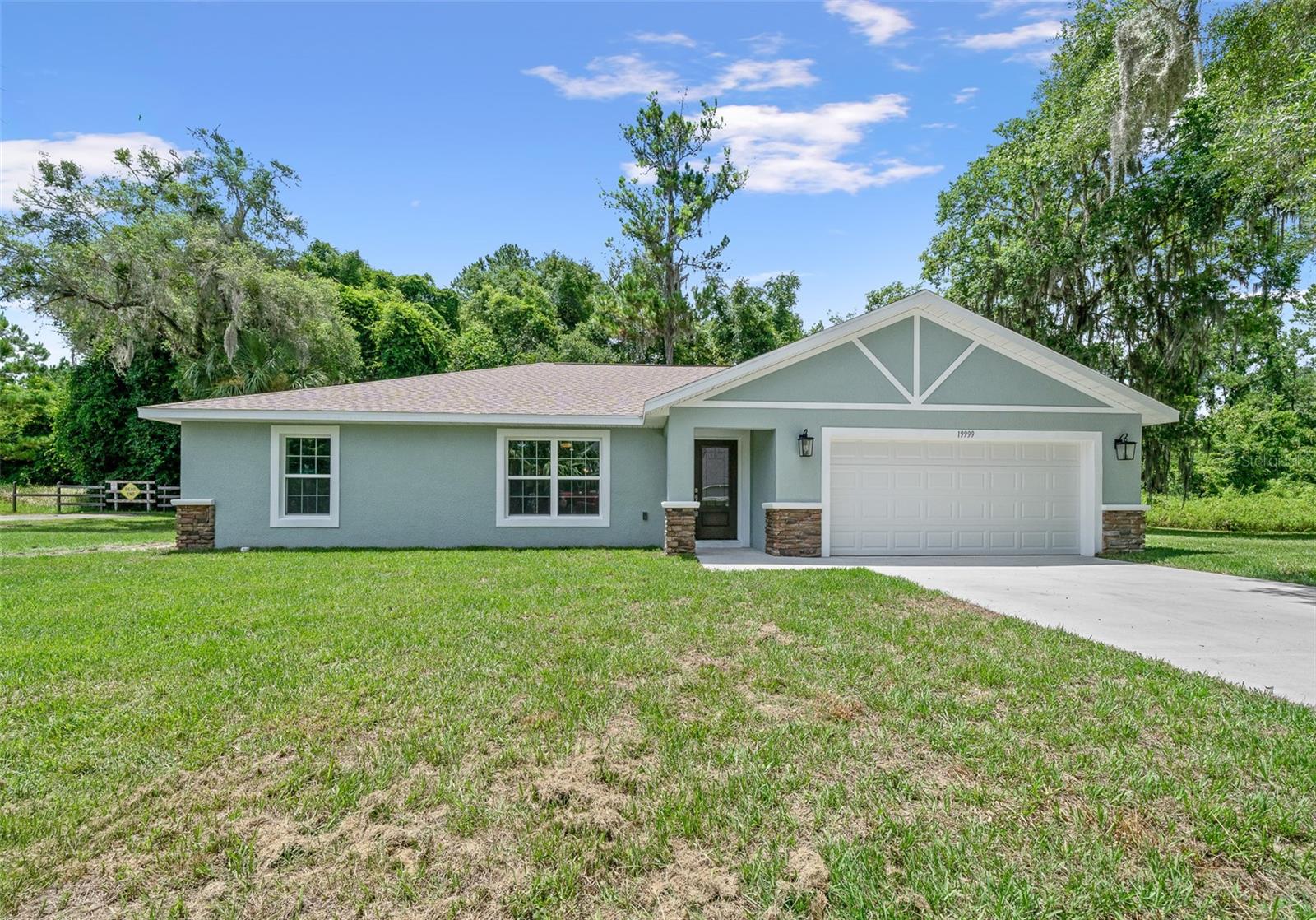 One or more photo(s) has been virtually staged. New construction 3/2 with 2 car garage in beautiful Blue Cove with community access to Rainbow River. The home is situated on a very private lot, facing a nature preserve in the back and just a few more homes on the street. The home welcomes you with a large living/dining/open kitchen area. Kitchen features all wood cabinets, soft close, stainless steel appliances and granite countertops. The master bedroom faces the private back yard and offers tray ceilings and large walk in closet. Step into the master bathroom with a double sink, granite countertops, tiled shower with glass enclosure and a privacy area for the toilet. 2 guest bedrooms and a shared bathroom with tub are on the other side of the home. Luxury vinyl flooring throughout and upgraded light fixtures. Plenty of storage throughout the home and a large 2 car garage for your cars, kayaks or golf cart. Drive down to the private community boat ramp area or Swampys restaurant at the entrance of the neighborhood. HOA fee for the year is $100! The community allows short term rentals for this perfectly located home. Some pictures are virtually staged. See walk through tour on listing. Hoem is completed and has CO.
Close to downtown Dunnellon with restaurants, shops, Rainbow River, Blue Run Park bike trails and more.
Some photos are virtually staged. CO expected and of June. One year builder and extended 2-10 warranty.