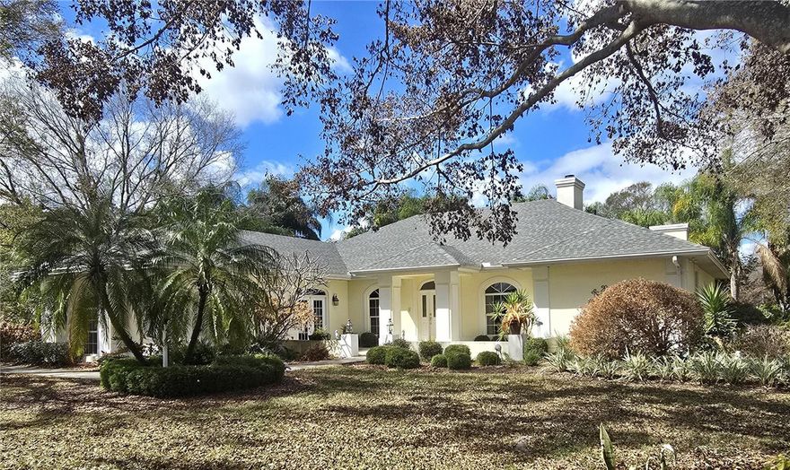 One or more photo(s) has been virtually staged. Don't miss out on this opportunity to own this beautiful home that in 1990 was an AWARD winner in the Polk County Builders Association Parade of Homes and built by local custom home builder Gordon Collins. Upon walking up the home your greeted with a very welcoming courtyard. This home has had some updates. The appliances in the kitchen are all updated Frigidaire Gallery Series. The roof was replaced in 2024. The pool/spa was resurfaced in 2023 and also comes with a 10 year warranty. The home features a split bedroom plan and a large open concept great room area, perfect for entertaining. Around the property is beautiful foliage providing privacy. Having a side load 3-car garage with high ceilings is also a bonus. Gorgeous views from inside of the home can be had from several vantage points. Beautiful natural lighting are also assets of the home. Perfect set-up for adding an an ourtdoor kitchen on the covered lanai/ pool area. Some of the furnishings will be included with this property.  There is also a central vacuum system throughout. This beautiful home in this desirable sought after neighborhood will not last long at this price.