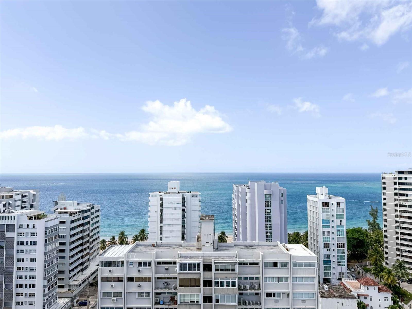 Welcome to Unit 1902 at Condado Real Condominium—an exceptional one-bedroom, one-bath apartment located in one of San Juan’s most sought-after neighborhoods. Situated at the corner of McCleary and King’s Court, this 19th-floor condo offers a rare combination of vibrant city living and spectacular ocean views.
Just one block from Condado Beach and one block from the restaurants, cafés, and shops of Calle LoÃza, the location is ideal for enjoying everything this dynamic area has to offer. SuperMax supermarket is only three blocks away, and weekend flower vendors bring color and charm to the neighborhood. Whether you're heading out for a beach day, a morning coffee, or evening cocktails, everything is at your fingertips.
The apartment spans approximately 700 square feet and is tiled throughout, providing a clean, low-maintenance interior. The open living area is full of natural light, with sliding glass doors that lead out to a private balcony overlooking the turquoise Caribbean Sea. From this height, you’ll enjoy stunning views stretching toward Ocean Park and beyond—perfect for relaxing or entertaining.
The updated kitchen features modern appliances, including a refrigerator/freezer, electric stove, and washer/dryer. A bar-height counter and decorative tile backsplash create a welcoming space for casual meals or hosting friends. The bathroom is bright and functional, with a sink, toilet, bidet, and a combination tub/shower—all finished in floor-to-ceiling tile.
The spacious bedroom can comfortably fit a king-sized bed and includes a large closet and a window facing the ocean, providing gentle breezes and natural light. You can fall asleep to the sound of the waves or wake up with the sun rising over the water.
Condado Real Condominium offers amenities that enhance everyday living, including 24/7 security with a doorman, an outdoor swimming pool, and an assigned parking space. One of its most valuable features is the full-building backup generator, ensuring continued comfort and convenience during any power interruptions.
Short-term rentals are not permitted, creating a quiet and stable residential environment—ideal for full-time residents or those seeking a peaceful Caribbean retreat.
This is a rare opportunity to own in a well-managed, amenity-rich building with one of the best locations in San Juan. Whether you’re looking for a primary residence, a winter getaway, or a long-term investment in Puerto Rico real estate, Unit 1902 at Condado Real is a standout option.