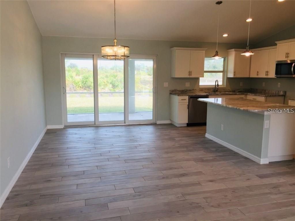 Photo of 9438 Fruitland Avenue, Englewood, FL 34224 (MLS # C7521188)