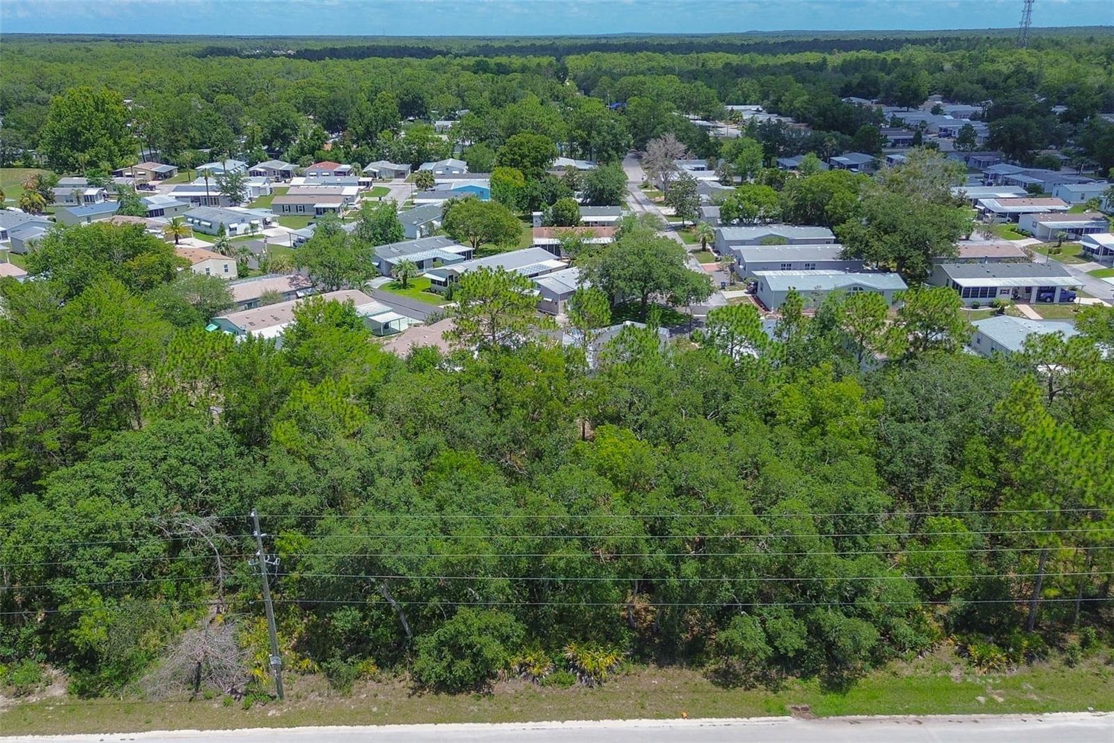 Imagine a peaceful slice of Florida just waiting to bring your vision to life—welcome to 6859 W Merrivale Lane, a gem tucked within the Oakdale Estates. This blank canvas of 0.21 acres, framed by the dimensions of 75 by 120 feet, offers the ideal foundation for your dream home. Whether you're envisioning a cozy retreat or a modern sanctuary surrounded by nature, this property gives you the freedom to build to your heart's content.
Situated on a paved road with 75 feet of frontage, access is smooth and straightforward, making every return home feel like a breeze. The lot lies in a flood zone X, offering peace of mind and fewer insurance concerns. This is land that whispers potential—elevated, dry, and ready for construction with essential utilities like electricity and public water already available at the site. A well will be required to complete your water system, and septic installation will be necessary to finish out the infrastructure—standard and manageable steps toward creating your personalized space.
With no HOA to dictate your design choices, you're free to construct your haven exactly as you envision it. Whether that means adding a workshop, extra storage, or even space for your pets to roam (yes, pets are welcome!), the possibilities are only limited by your imagination. There's no association telling you how often you can rent it out or whether your architectural style fits a mold—this is freedom to build, live, and invest your way.
Beyond the bounds of this lot, you're surrounded by the quiet charm of a growing community. Adjacent state-owned land adds to the privacy and natural beauty, making this not just a place to live, but a place to thrive in connection with the land. The setting is serene, the road is paved, and the sunrises are yours to savor.
Whether you're looking to break ground now or invest for the future, 6859 W Merrivale Lane is more than just a lot—it's a launchpad for possibility. Secure your spot in the sunshine and start imagining the life you could build here. The ground is ready. Are you?