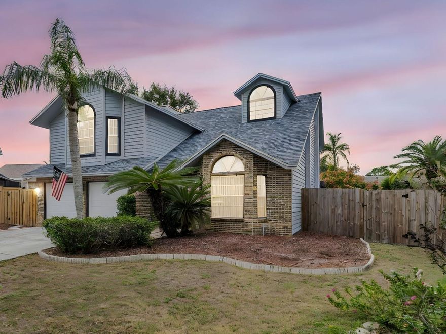 DOES NOT REQUIRE FLOOD INSURANCE!
MAJOR UPDATES: Garage doors & openers (2025), Roof, Pool Pump & Filter (2024), HVAC & Water Heater (2019)

Welcome to this beautifully maintained two-story POOL home in the heart of Palm Harbor! Featuring 3 bedrooms, 2.5 baths, and PLUS a large loft, this residence sits on a meticulously landscaped lot and offers a perfect blend of style, comfort, and functionality.

Step inside to soaring 30-foot vaulted ceilings and an abundance of natural light that fills the open-concept living and dining areas. The inviting living room is ideal for both relaxing and entertaining, complete with a cozy fireplace and pool views through large windows.

The renovated kitchen is a chef’s dream, featuring solid wood, soft-close cabinetry, granite countertops, new appliances, and a spacious island perfect for meal prep or casual dining. A beautifully updated half bath is conveniently located on the main floor.

Upstairs, the loft area offers endless flexibility—ideal for a home office, playroom, or easily converted into a fourth bedroom. The primary suite is a true retreat, boasting generous space, bright windows, and a luxurious ensuite with dual vanities, a soaking tub, and a separate walk-in shower. Two additional bedrooms and a full bath complete the upper level.

Step outside to your private backyard oasis, featuring a large, screened pool and lanai, perfect for lounging or entertaining. The oversized pool invites endless fun, while the fenced yard offers plenty of room for pets or play.

Additional highlights include an oversized two-car garage with laundry area. Located less than a mile from top-rated Palm Harbor schools, this home also offers access to community amenities including a park, tennis courts, and a pool.

This Palm Harbor gem truly has it all, modern updates, prime location, and resort-style living. Schedule your private showing today!