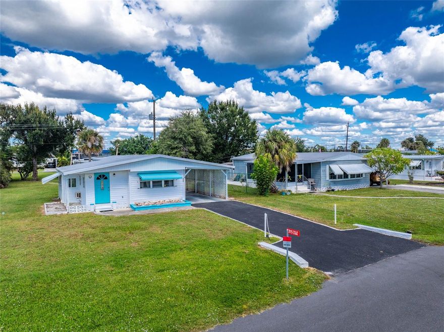 Wow!  Under $100,000 for this fully furnished CLEAN AND NEAT two bedroom/one bath manufactured home in Mobile Gardens!  And you don't have to be 55 to live here!  Why pay lot rent when you can OWN the real estate?  Updated laminate flooring in the living and dining area make maintenance a breeze. Living room has a little bit of a cathedral ceiling, plus a ceiling fan. Kitchen has updated cabinet doors and countertops, refrigerator and stove, plus filtration filter for drinking water. Primary bedroom has stylish beadboard, and a wall closet, and Bedroom #2 - although small - has a wall closet and room for a twin bed. Bonus room off the dining area would be a great place for your office or hobby area. Washer and dryer are located in the utility room behind the carport.  Central heat and air! There are 30 community boat slips available via a wait list. Additional fee is $100/yr and voluntary membership is only $175/yr.  The clubhouse has a library, shuffleboard and more! NO MANDATORY HOA FEES if you choose! This park has a great location in Englewood, just minutes away from the beach, shopping, banking, restaurants, Walmart, Walgreens, and lots more! This home would make a perfect snowbird nest to get away from those nasty cold winters!