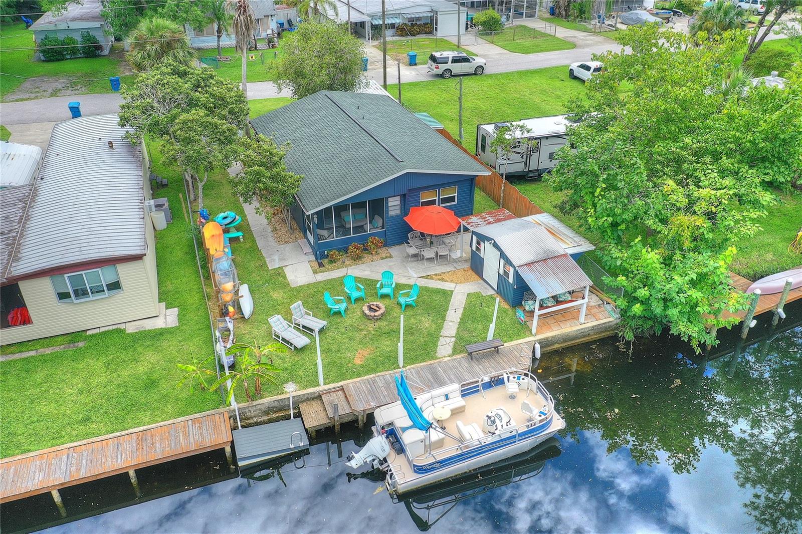 Discover this stunning 2-bedroom, 2-bathroom waterfront canal home nestled on the serene Weeki Wachee Springs River with direct Gulf access. Freshly painted and beautifully designed with a charming coastal vibe, this residence features a stunning kitchen and spacious, airy interiors filled with natural daylight and captivating waterfront views. Whether you're seeking a primary home, a vacation retreat, or a lucrative rental opportunity—since there's no HOA—the possibilities are endless. Enjoy the convenience of two docks, a seawall, shed/workshop, and a screened porch, all set on a prime location ideal for short-term or long-term rentals. Build your dream home or simply indulge in peaceful waterfront living—this is a rare opportunity you won't want to miss!