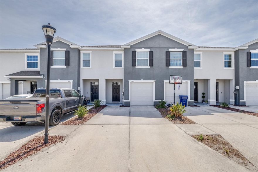 Newer construction with a beautiful view! Step into this 3 bedroom, 2 and a half bathroom, 1673 square foot townhome in the exclusive Union Park Community in Wesley Chapel! Built in 2019, this unit has been kept up wonderfully during the time that the sellers have owned it. Walking through the front door (digital keypad and camera included) brings you through to an open floor plan with a scenic water and conservation view! 

On the way to the main living area, there is a conveniently located guest half bathroom on the left, and a one car garage on the right which has hooks and extra space for storage! Walking into the main living area, there’s dining room space on your left with pendant lighting! To your right is the kitchen, featuring, granite countertops, soft close cabinets and drawers, recessed lighting, garbage disposal, a walk-in pantry and Frigidaire appliances! There’s an island with areas for seats, perfect for entertaining! The kitchen leads into the living room space, with your water view visible right from the couch! The patio has been screened in, providing an ideal spot for relaxation! There’s an extra storage closet downstairs also! 

The living room, stairs, and upstairs hallways carpets have all been replaced! The stairs lead you up to all of the bedrooms and remaining bathrooms. The spacious master suite is away from the guest bedrooms, providing ample privacy. It features a stunning view of the backyard, as well two closets (one of them is a walk-in closet)! The master bathroom has Jack and Jill sinks and a walk in shower! Walking back through the hallway (recessed lighting throughout) leads you to the Frigidaire washer and dryer, conveniently tucked away behind doors on your left, and the additional full bathroom on the right, including a tub! Towards the end of the hallway are two additional spacious guest bedrooms! All of the bedrooms have ceiling fans. The home is pre-wired for security, and also comes with a Ring doorbell and cameras in the front and back! 

The community features access to two pools, a basketball court, fitness center, walking trails, a dog park, and more! The HOA fee includes high speed internet, cable, exterior maintenance, lawn care and more! Wesley Chapel offers everything you can imagine - You’re a short drive away from iconic restaurants and shopping centers, hospitals, parks, and anything else you can think of! You’re less than 40 minutes away from downtown Tampa and the Tampa International Airport! Disney is an hour away, and about an hour from the beaches! Come check out this townhouse before it’s gone!