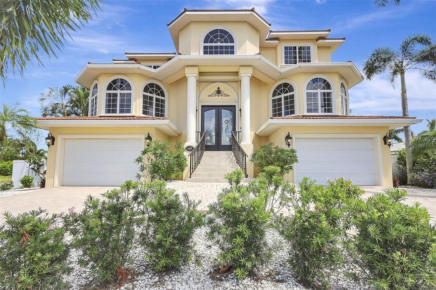 Live the resort lifestyle every day in this breathtaking waterfront retreat in Treasure Island. With timeless Mediterranean elegance and coastal charm, this custom-built home offers panoramic water views, spacious indoor-outdoor living, & luxurious touches throughout.

Step through the double entry doors into a bright, open interior designed for both comfort and sophistication. The 2nd floor living area flows seamlessly onto a large waterfront patio, perfect for relaxing or entertaining with sunset views over Boca Ciega Bay. A spiral staircase leads down to the pool, spa & grilling station, where lush surroundings & bay breezes create your own private paradise.

The heart of the home is the expansive kitchen, ideal for gathering with family & friends. It features generous prep space, custom cabinetry, & a walk-in pantry. Adjacent to the kitchen is a stunning butler's pantry, complete with a wet bar, designer cabinetry, & a wine chiller; an entertainer's dream.

The family room, complete with a cozy fireplace, invites year-round enjoyment, while multiple access points—including from the first-floor yard level & the 2nd floor patio—make indoor & outdoor living effortless.

Boaters will love the deep sailboat water access, 10,000 lb boat lift, & extended dock all just steps from your backyard. Whether you're heading out to the Gulf or watching dolphins play from the dock, this location offers the ultimate in waterfront living.

Additional features include high-impact windows & aluminum-tiled metal roof, Cat 5 wiring, surround sound, and security system. Concrete seawall & cap, smoke & carbon monoxide detectors.

Enjoy peaceful mornings by the pool, vibrant evenings on the water, & a lifestyle that feels like a permanent vacation. Conveniently located near Florida's finest beaches, airport access, top-rated dining, shopping, and more! This home is the epitome of coastal luxury.