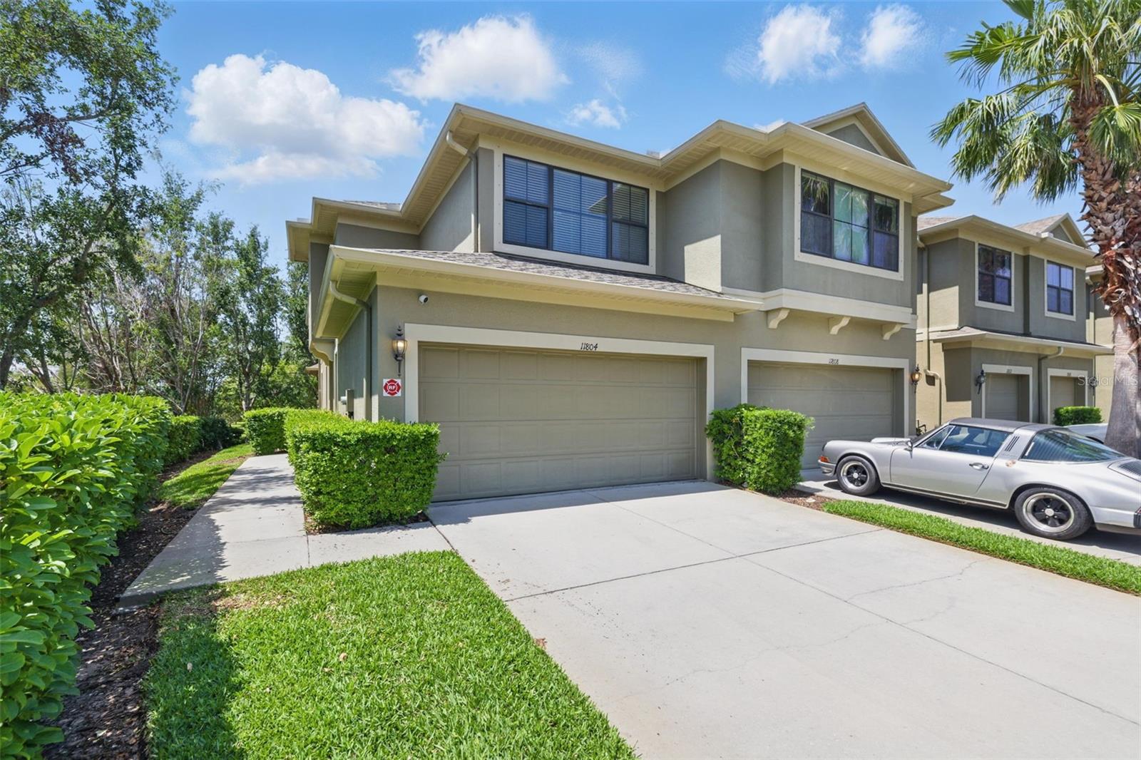 ~~FOR LEASE AVAILABLE NOW~~Spacious END UNIT townhouse located in St. Petersburg featuring 3 bedrooms (PRIMARY SUITE ON FIRST FLOOR), 2.5 bathrooms, a large loft, and a two car garage. This particular corner unit provides a cul-de-sac like feel and is great for families as well as young professionals. The home is centrally located in St Pete/Tampa Bay just minutes from I-275 lending close proximity to downtown St. Petersburg, Tampa International Airport, St. Pete Clearwater Airport, and the beaches. This luxurious townhome features several upgrades including hand-scraped wooden flooring, granite countertops, a breakfast bar, 20ft ceilings with an elegant chandelier, and a modern kitchen with recessed lighting. Washer and dryer are included in the laundry room adjacent to the kitchen. The master bedroom is located on the bottom floor featuring an ensuite including a jacuzzi tub, shower, double vanities, and walk-in closet. There is a large floor-to-ceiling built-in wardrobe in the master bedroom for additional storage and convenience. Upstairs you will find two additional bedrooms that provide plenty of space for kids rooms and/or an office, along with an open loft/flex space and built-in library with dimmable lighting. Beyond the living room you will find triple sliding glass doors which lead to a private enclosed patio with a TV mount for enjoying the beautiful outdoors in Florida. Located in the Townhomes at Bay Isle community, residents also have access to a pool year-round. Renter responsible electric and cable/internet.