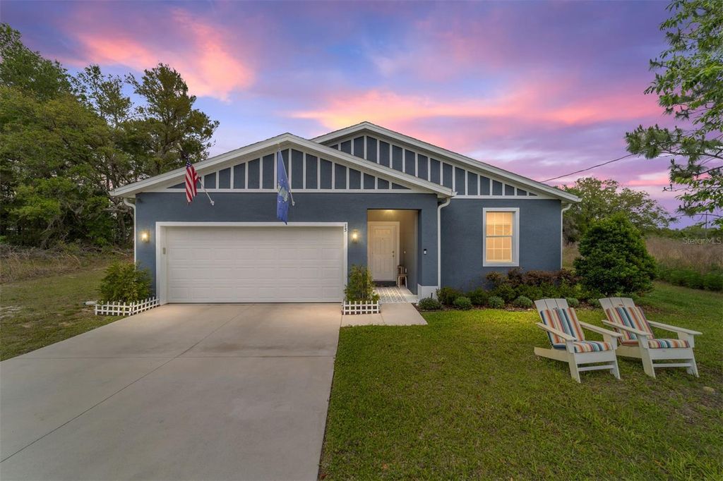Photo of 15 Malauka Circle, Ocklawaha, FL 32179 (MLS # OM723523)