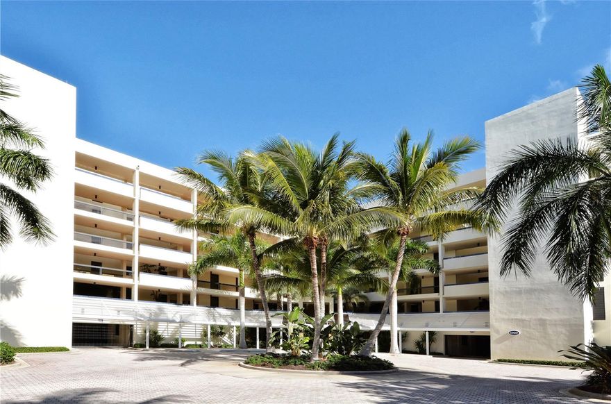 Welcome to your waterfront retreat in the highly sought-after Fairway Bay community, where relaxed coastal living meets thoughtful design and modern comfort. This beautifully renovated 2-bedroom, 2-bath condominium offers nearly 1,200 square feet of light-filled interior space, along with sweeping views of Sarasota Bay and the downtown skyline that create a stunning and ever-changing backdrop throughout the day.

Fully updated in 2020 and professionally curated by an interior designer, the residence showcases a refined yet inviting aesthetic. Inside, the open-concept layout is enhanced by warm, driftwood-inspired luxury vinyl plank flooring and an abundance of natural light. The living and dining areas flow effortlessly together, while expansive pocketing sliders open wide to a private balcony, creating a seamless indoor-outdoor experience ideal for both quiet mornings and evening entertaining. From this vantage point, you can take in tranquil water views, coastal breezes, and vibrant sunsets that define the Longboat Key lifestyle.

The galley-style kitchen is both stylish and functional, featuring quartz countertops, crisp Ivory soft-close cabinetry, stainless steel appliances installed in 2020, and a peninsula with seating that invites casual dining and conversation. The design balances clean lines with timeless finishes, making it equally suited for everyday living and hosting guests.

The spacious primary suite serves as a private sanctuary, offering generous proportions, beautiful bay views, and direct access to the peaceful ambiance of the home. The en-suite bath is thoughtfully appointed with dual vanities, elegant lighting, and a walk-in tiled shower, creating a spa-like atmosphere. The guest bedroom and accompanying bath are equally well-designed, providing comfort and privacy for visitors while maintaining the home’s cohesive style.

Additional features include plantation shutters on all windows and sliders, a private exterior entrance that enhances both convenience and privacy, a welcoming balcony seating area, and professionally landscaped surroundings that add to the property’s curb appeal. Important updates such as a new air conditioning system and water heater provide peace of mind, making this a truly move-in-ready opportunity.

Fairway Bay, located within the desirable Bay Isles community, offers a lifestyle rich in amenities and natural beauty. Residents enjoy gated entry with 24-hour guard service, beautifully maintained grounds, resort-style pools, a clubhouse, fitness center, and tennis courts. Scenic walking and biking paths wind along the bay, while a kayak and paddleboard launch provides easy access to the water for outdoor enthusiasts. Ownership also includes exclusive access to a private beach club on the Gulf of Mexico, offering the rare advantage of experiencing both serene bayfront living and pristine Gulf beaches.

Ideally situated near the renowned The St. Regis Longboat Key Resort, this residence is just moments from exceptional dining, shopping, and leisure experiences, further enhancing its appeal as both a full-time residence and seasonal escape.

This is more than just a condominium—it is an opportunity to embrace the relaxed elegance, natural beauty, and effortless lifestyle that make Longboat Key one of Florida’s most coveted coastal destinations.