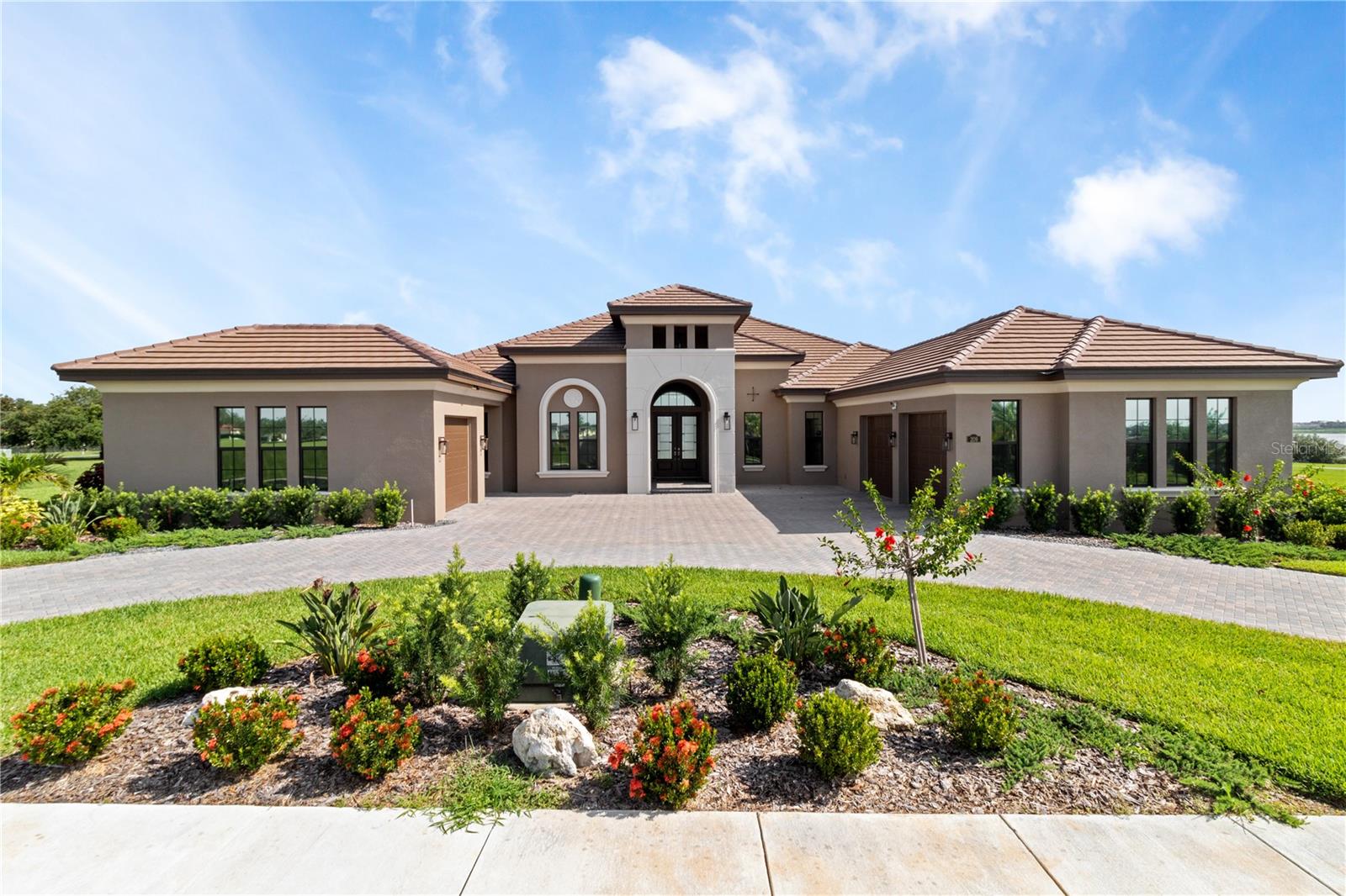 Modern Luxury Meets Lakeside Living in Lake Alfred!
Welcome to this stunning 2024 custom-built AR Kensington home, perfectly situated on a scenic ridge with beautiful views of Lake Alfred. This one-story masterpiece offers 4 spacious bedrooms, each with its own private en suite bathroom, delivering comfort and privacy for family and guests alike.
This home offers 3,547 sq ft of heated living space (totaling 5,301 sq ft under roof), where you’ll find a dream kitchen featuring a massive natural quartz island 5.25'ft x 9.75'ft with sink 30"in x 15.5"in, equip with garbage disposal. A large hidden walk-in pantry built in next to fridge with ample storage. Brand new stainless appliances, GE convectional ovens, a 10 bottle wine closet display with stone accent and lighting. Under counter wine fridge. Plenty of room to gather and entertain. Thoughtfully designed for both everyday living and celebration, stepping out to the lanai you'll have a full wet bar and grill by the pool, complete with a built-in ice machine and two refrigerators tucked into the outdoor island, two large TV mounts, BT surround sound speakers, perfect for Florida’s endless summer days.
Enjoy your private screened-in salt pool and spa, surrounded by mature landscaping equip with irrigation and lake views. Whether you’re relaxing in the spa or entertaining on the patio, this area was made for making memories.
The owner’s suite features a luxuriously oversized two door walk-in shower and Kohler BT controls and throughout the home, you’ll find quality craftsmanship, open spaces, and high-end finishes including tray ceilings and crown moulding.
Additional highlights include:
•Two Tankless Gas Water Heaters
•Heated Salt Pool 7 jet and Spa 4 jets with lighting features
2 pumps.
•Color adjust features around island on lanai
•Bluetooth Surround Sound System inside and out
•Paradise Professional Hybrid X Grill system( 10 in 1) gas and charcoal convert.
•Vivint security system
•Three-car garage
•Half-circle driveway for added convenience and curb appeal.
•surround sound speakers inside and out BT and controlled with App.
•home is prewired for generator install.
This Lake Alfred gem truly checks all the boxes for elegant, modern living in Central Florida. Schedule your private tour with me today, you won’t want to miss this one!
* All measurements are estimated and taken from public record; buyer and buyers agent to verify all dimensions and pertinent listing information independently
** TV'S WILL BE INCLUDED IN THE SALE OF PROPERTY ONLY WITH FULL ASKING PRICE.
**All indoor and outdoor furniture is negotiable and will be sold separately from real property. Furniture is not included in the sale of home and will be subject to a separate Bill of Sale. The buyer shall remit payment for any agreed upon furnishings directly to the sellers.