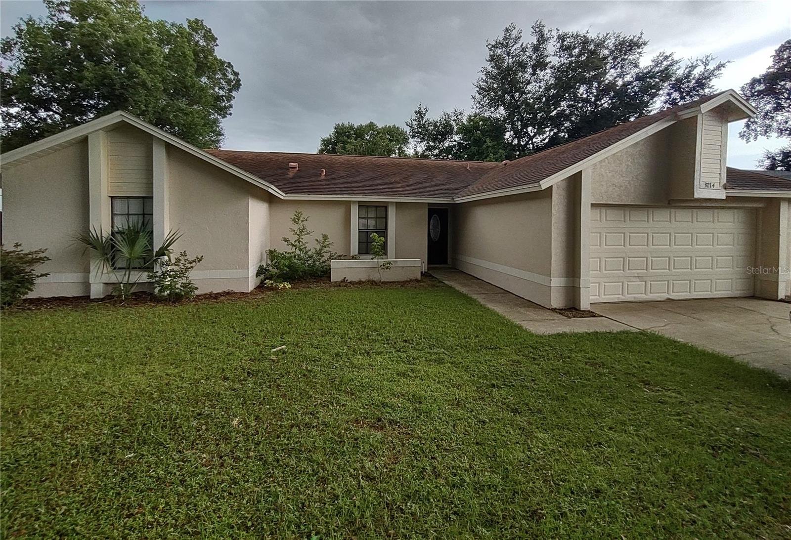 This four bedroom, two bathroom home is located in the lovely Hunters Trace Community. It has a large rear screened in porch, large fenced in backyard and a spacious two car garage. This home has a beautiful custom kitchen with a vaulted ceiling with an eat in area. Kitchen includes stainless steel appliances and granite countertops. The living room is next to the master bedroom to the right side of the house and the other two bedrooms, the family room, kitchen, and back patio on the left side. The guest bathroom shower was recently retiled for a more contemporary look. There is no carpet throughout the entire home. Home is all tile throughout. This house is conveniently located west of Dean Road and South of University Blvd. It is located within close proximity to the 417/Greenway Expressway. It is also near the University of Central Florida, Valencia College, Waterford Lakes shopping center and walking distance to a beautiful local park with biking trails.