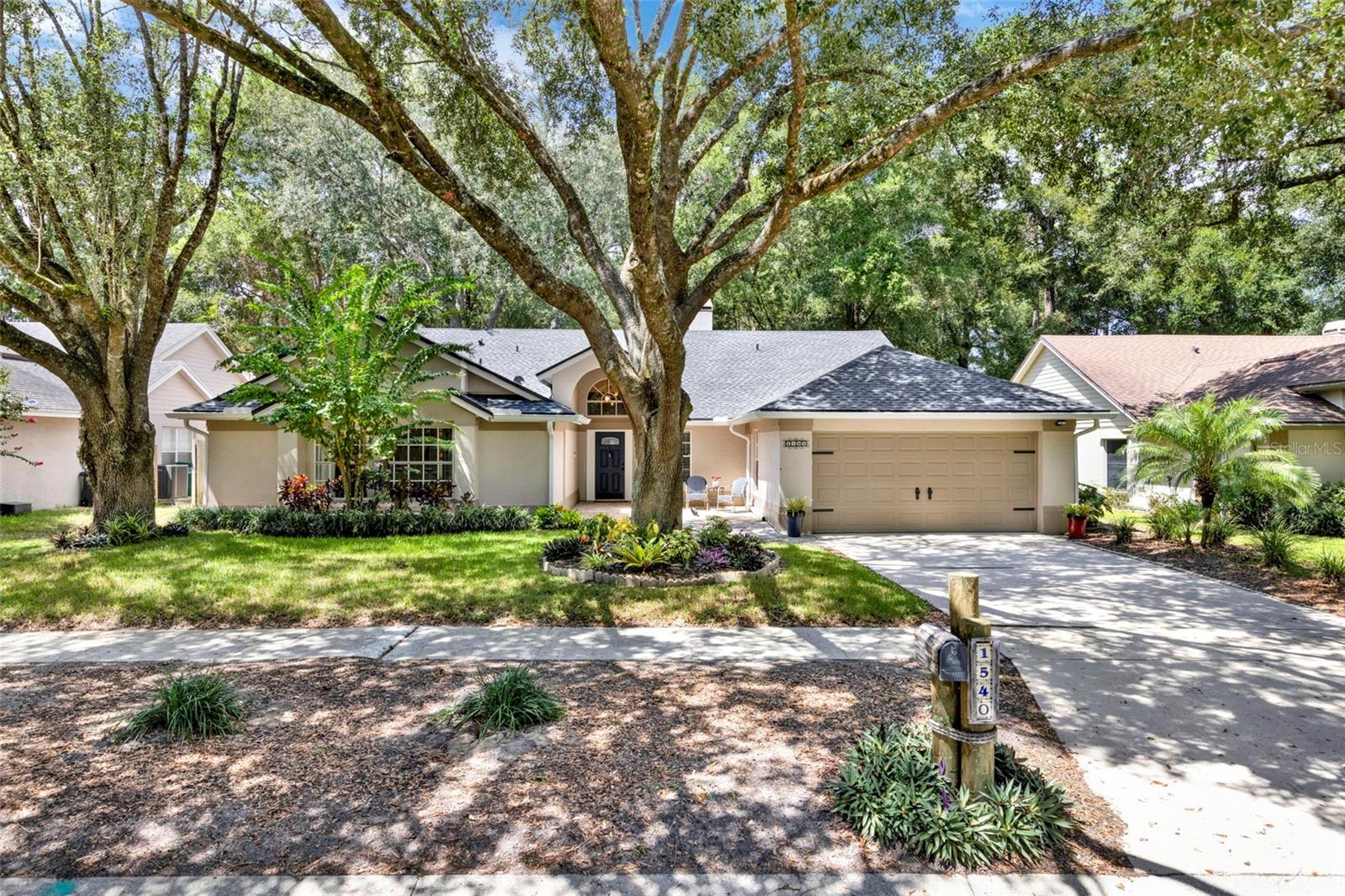 Welcome to 1540 Bent Oaks Blvd, a beautifully updated 4-bedroom, 2-bath home tucked into one of Deland’s most sought-after neighborhoods. Set on a peaceful conservation lot, this 2,357-square-foot residence offers timeless charm with a fresh, modern twist. Inside, you'll find a brand-new kitchen with sleek finishes and updated appliances, complemented by new flooring that flows seamlessly throughout the home. The spacious split floor plan includes formal living and dining areas, a cozy family room with a double-sided fireplace, and a tranquil primary suite with private access to the screened lanai—perfect for enjoying quiet mornings or unwinding at sunset. A brand-new roof adds peace of mind and curb appeal, while the mature oaks and natural backdrop create a serene, storybook setting. This move-in-ready gem blends nature, comfort, and style in a way that feels both elevated and inviting. Make it yours and create your own memories.