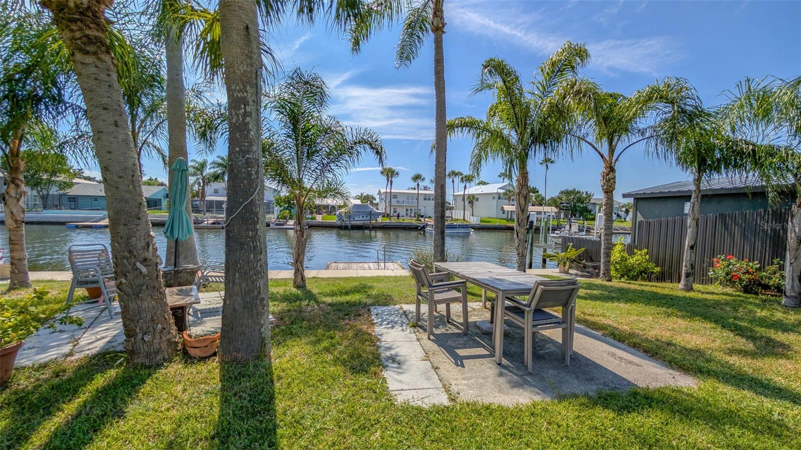 Build your dream home in Hernando Beach.
Don’t miss this amazing opportunity to own a REAR WESTERNLY FACING property in the DIRECT GULF ACCESS SECTION of HERNANDO BEACH. The water behind the property is deep and there are NO BRIDGES AND EASY ACCESS TO THE GULF through the main channel.
The property has 60 foot of waterfront with an almost NEW SEAWALL and a floating dock. WATER AND SEWER ARE ALREADY PRESENT ON THE PROPERTY. The property is fenced in and has been landscaped around the outer edges in anticipation of a new home. The shed and fish cleaning station convey.
The property is zoned residential and in the flood plane. No mobile homes are not allowed. All new homes would have to be elevated outside of the flood plane.
Hernando Beach is a vibrant waterfront community that offers the best of coastal living—boating, kayaking, paddleboarding, fishing, and more. Just minutes from the world-famous Weeki Wachee Springs, residents also enjoy close proximity to shopping, dining, hospitals, and top-rated schools. The community is golf cart friendly and allows short-term rentals with no HOA, no deed restrictions, making it perfect for full-time residents, part-time snowbirds, or investors. The Suncoast Parkway offers easy commuting to Tampa, Brooksville, and beyond.
