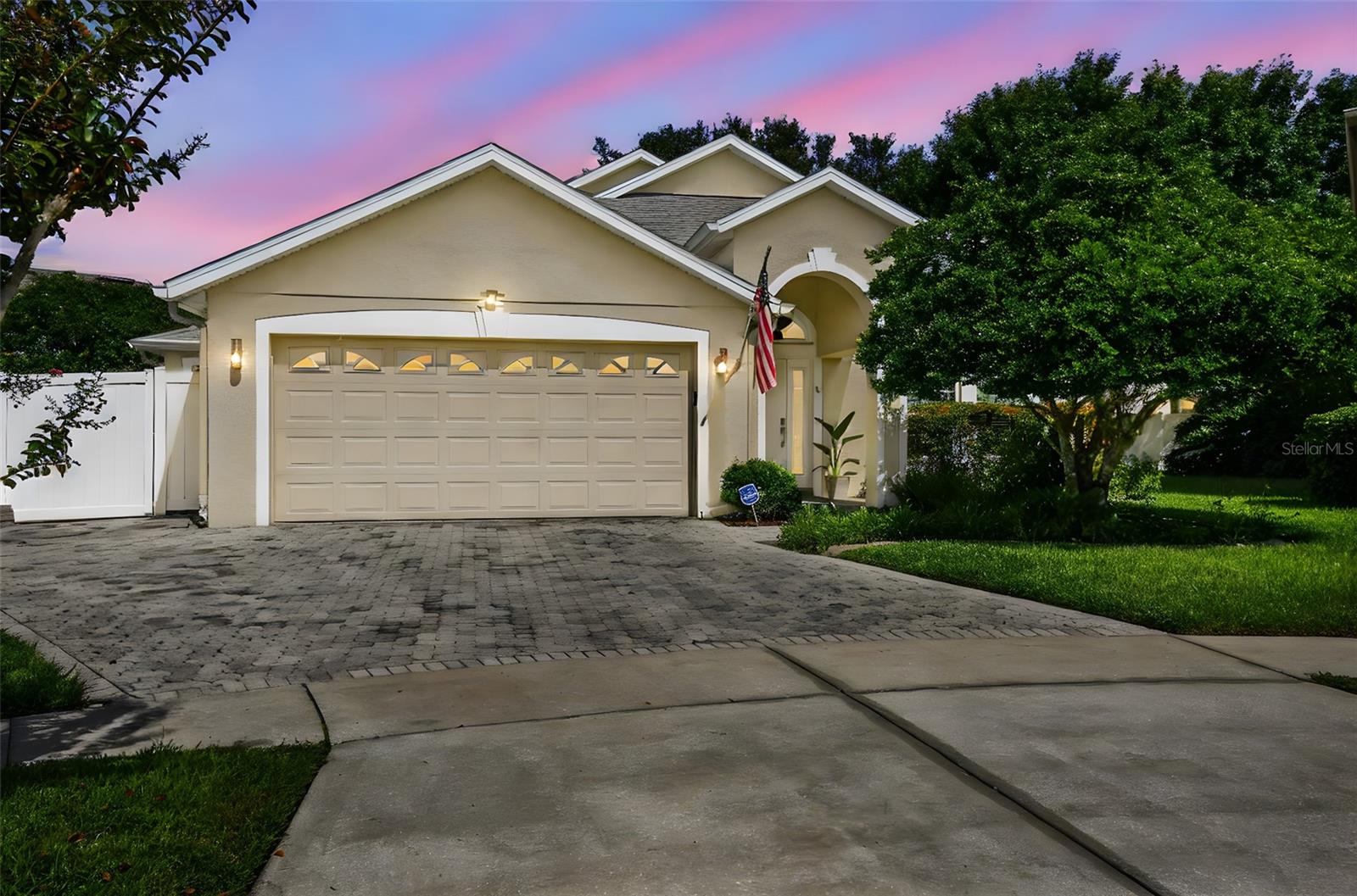 Presenting 17617 Woodfield Hill Court—an exceptional single-story pool home set on a tranquil cul-de-sac in the distinguished Cypress Lakes community of East Orlando. Expertly remodeled and impeccably maintained, this elegant home seamlessly blends timeless design, elevated finishes, and cutting-edge efficiency to create a lifestyle of comfort, sophistication, and ease. Upon arrival, the home’s stately curb appeal is enhanced by a wide paver driveway and manicured landscape. Inside, you are welcomed by expansive 12x18 glass tile flooring laid in a professional mud-set with crack suppressant—a sleek, cohesive canvas extending throughout the entire home. Designed with modern living in mind, the open-concept floor plan effortlessly connects the formal living and dining spaces with a light-filled dinette and spacious family room. At the heart of the home is a chef’s kitchen of exceptional quality, appointed with premium Samsung appliances including a built-in oven, microwave drawer, range top, vented hood, and refrigerator. A generous island, quartz countertops, espresso maple cabinetry, tile backsplash, deep basin sink, and under-cabinet lighting complete this culinary space with both beauty and function. A custom-designed entertainment center elevates the family room, creating an ideal gathering space for quiet evenings or stylish entertaining. The split-bedroom layout ensures privacy, with a serene primary suite offering a coffered ceiling with birchwood trim, a walk-in closet with California Closet shelving, and a spa-inspired en-suite bath with an oversized, custom-tiled shower. Beyond the interior, a private outdoor retreat awaits. The expansive screened lanai, extended paver patio, and open-air pool with water features provide a resort-style setting for al fresco dining, leisure, and weekend entertaining. This home’s thoughtful upgrades go beyond aesthetics. Hurricane-impact windows, a paid-in-full solar panel system, and a 2017 smart HVAC system contribute to both peace of mind and long-term energy efficiency. Additional features include smart LED lighting, automated window blinds, a smart home control pad, a water softener system, modern lighting fixtures, and a fully fenced backyard with Florida-native plants and a butterfly garden. Cypress Lakes offers exclusive access to a range of lifestyle amenities, including a resort-style clubhouse, pool, fitness center, playgrounds, and nature trails—all within close proximity to upscale shopping, dining, and top-rated schools. 17617 Woodfield Hill Court is a residence of distinction—where elegant design, modern technology, and everyday comfort come together. Come see this lovely pool home today.