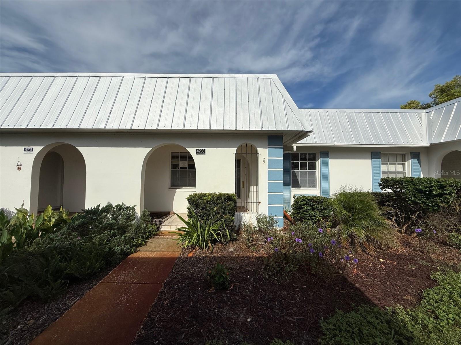 Welcome to this 2 bedroom, 1 bathroom in the Gardens of Beacon Woods - just 1 mile from US 19. Gated, 55+ community featuring a clubhouse and pool with the HOA fees including water, sewer, trash, and internet! The interior features a living room/dining room combo, enclosed back porch, and a kitchen with Corian counter tops. There's a convenient washer and dryer hookup in the front bedroom closet and laminate flooring throughout most of the living space (no carpet in this unit). Don't miss out on this one! Call today. This property is eligible under the Freddie Mac first look initiative through 10/16/2025.