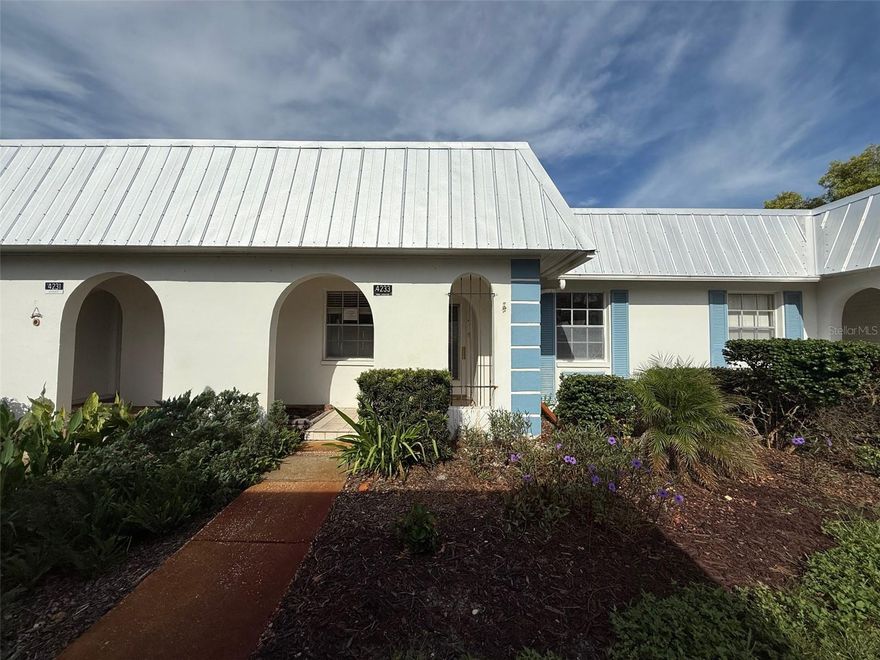 Welcome to this 2 bedroom, 1 bathroom in the Gardens of Beacon Woods - just 1 mile from US 19. Gated, 55+ community featuring a clubhouse and pool with the HOA fees including water, sewer, trash, and internet! The interior features a living room/dining room combo, enclosed back porch, and a kitchen with Corian counter tops. There's a convenient washer and dryer hookup in the front bedroom closet and laminate flooring throughout most of the living space (no carpet in this unit). Don't miss out on this one! Call today. This property is eligible under the Freddie Mac first look initiative through 10/16/2025.