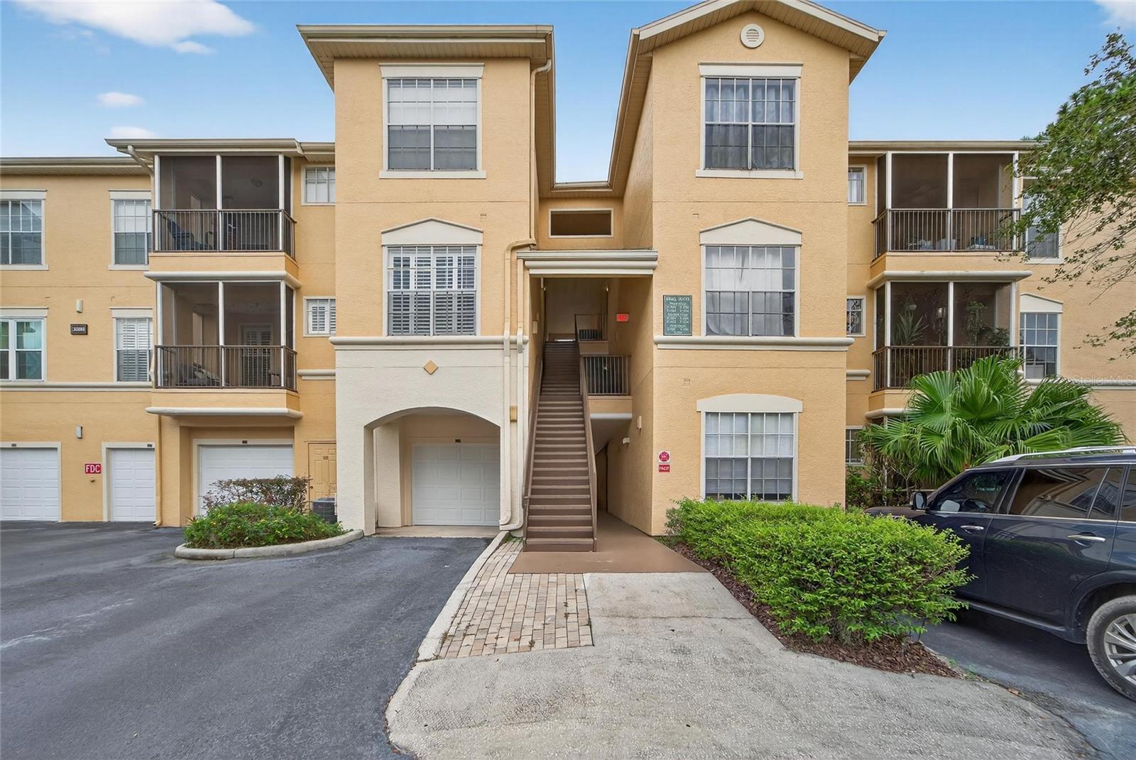 Welcome to this beautiful, spacious 2-bedroom, 2-bathroom split floorplan condo with an attached garage; located in the well-maintained maintenance free gated community, Oxford Place! This first-floor unit with NO backyard neighbors adds comfort, privacy, and convenience—perfect for full-time living or a lock-and-leave lifestyle...Enjoy a bright and open layout with fresh interior paint, tinted Low-E, double-glazed energy efficient windows that will help with both electric bill savings & sound proofing, and a BRAND-NEW A/C system (July 2025) for year-round comfort. The split floorplan provides ideal separation between the bedrooms, offering privacy for guests or roommates.
Step outside to a wealth of community amenities, including a beautiful pool, gym, volleyball, and playground. As an Oxford Place resident, you also gain access to Club Tampa Palms just half a mile away!! Club Tampa Palms has 3 pools, an exceptionally large gym, two tennis courts, a basketball court, a multipurpose room, and saunas in the locker rooms. Oxford place is a gated, maintenance free community with 24/7 virtual security and is walking distance to Chiles Elementary! Minutes from I-75, USF, Wiregrass mall, dining, and shopping, Flatwoods Park, USAA, Advent Health, and Moffitt Cancer Center.
