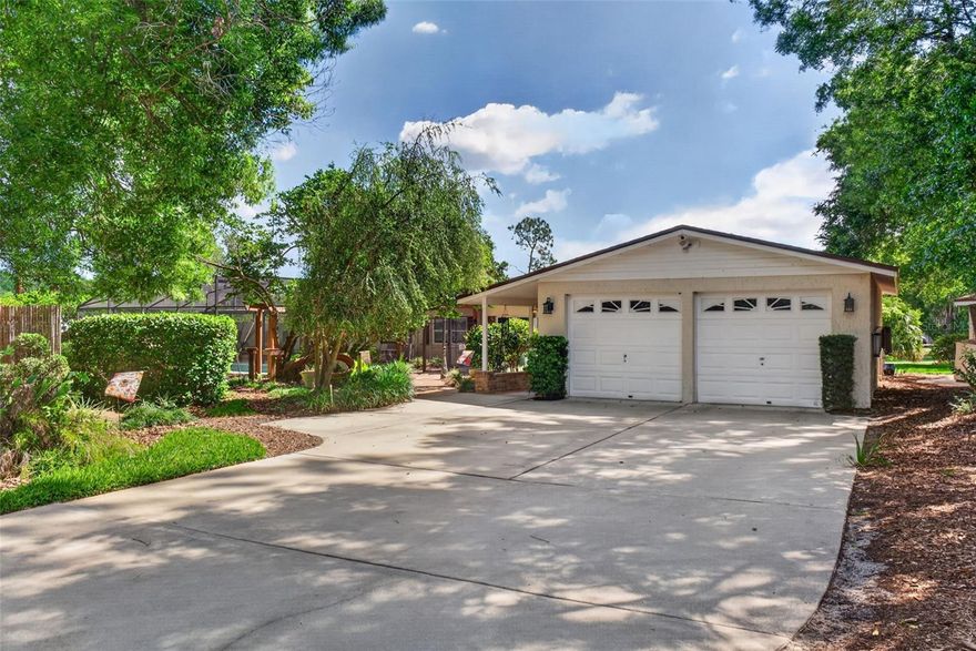This is one of those homes that buyers wait for, a rare opportunity to own a ONE-OF-A-KIND MID-CENTURY gem where nature, land, and character come together. Tucked into one of Longwood’s most unique locations set along the former 10th hole of the historic Rolling Hills golf community, this home is nestled among rolling green space, WATER VIEWS of Lake Jeanette, & established mature landscaping. Positioned on OVER HALF AN ACRE in a DESIGNATED GOLF CART COMMUNITY with NO HOA, this retreat offers privacy & connection to nature while still being just minutes from I-4, shopping, restaurants and everything you need in the heart of Longwood. A long driveway shaded by mature trees creates a welcoming arrival, while a private canopy of trees sets the peaceful setting found throughout. The outdoor lifestyle begins the moment you arrive. A GARDEN-INSPIRED landscape welcomes you with greenery, a FIRE PIT gathering area & detached storage shed ideal for gardening or creative projects. Multiple outdoor spaces create a PARK-LIKE SETTING designed for relaxing, entertaining, & enjoying the outdoors. With a front garden retreat, private pool, backyard patio overlooking rolling hills, and side-yard screened-in patio space, you won't want to leave home! Made for easy Florida living, the SCREENED-IN SALTWATER POOL offers a private sanctuary framed by distinctive MID-CENTURY arches. Relax in a hammock, feed the ducks, or enjoy a poolside gathering. Winding pathways connect seating areas, brick patios, covered spaces, and quiet corners beneath mature trees, creating the perfect outdoor retreat. A breezeway connects the home to the OVERSIZED DETACHED TWO-CAR GARAGE, adding function & charm. The oversized garage includes a dedicated WORKSHOP SPACE for hobbies, storage, & projects. A separate dedicated GOLF CART GARAGE adds convenience and reflects the neighborhood’s laid-back lifestyle. There's also a front parking area providing ample room for trailers, recreational equipment, work vehicles or additional storage needs, another advantage of living in a NO HOA community. Inside, NATURAL LIGHT pours through large windows, highlighting the residence’s MID-CENTURY charm and thoughtful updates. Arched openings, wood ceilings, & built-in shelving enhance the home’s character, while wood flooring complements the timeless design. The living & dining spaces flow into a kitchen featuring rich cabinetry, exposed wood detail, brick accents, & expansive windows that bring the surrounding greenery indoors. The layout includes 3 bedrooms, 2 bathrooms (one is dual entry), & WALK-IN CLOSETS in every bedroom. The area is known for its open green space, walkable streets, & being an active lifestyle neighborhood, including an annual holiday golf cart parade! The surrounding space creates a peaceful, almost country-like setting while remaining close to everything. Significant updates include NEW ROOF (2024), WHOLE HOME GENERAC PROPANE GENERATOR (2020), NEW DRAIN FIELD (2022), NEW ELECTRIC WATER HEATER (2023), NEW KITCHEN WINDOWS (2023) & new pool enclosure screens (2024). Additional improvements include waterproof laminate flooring (2022), paint/trim, baseboards, blinds/drapes, ceiling fans, & garage door openers (2021), foyer tile (2026), exterior garage lighting (2026). The home also includes an ACTIVE TRANSFERABLE TERMITE BOND. With Phase One of the Rolling Hills Community Park already underway, this amazingly unique home offers lifestyle, location, and LOTS of future potential!