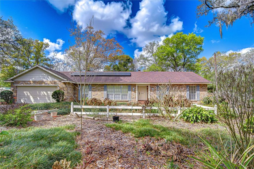 Charming ranch-style home in Oakland offering space, comfort, and incredible flexibility! This well-designed residence features three spacious bedrooms and multiple living areas to fit a variety of lifestyles. Large windows throughout fill the home with abundant natural light, creating a bright and welcoming atmosphere in every room. Enjoy cozy evenings by the wood-burning fireplace in the inviting family room, while the formal living and dining rooms provide the perfect setting for gatherings and entertaining. The kitchen sits at the heart of the home and connects easily to a spacious den, ideal for a home office, playroom, media room, or additional living space. Step outside to a large screened patio, the perfect place to relax, entertain, or enjoy the outdoors year-round. The generous backyard offers plenty of space for gardening, outdoor activities, or creating your own backyard oasis. Energy efficiency is another standout feature with solar panels that help keep the electric bill exceptionally low, offering both comfort and long-term savings. Ideally located just minutes from the JC Handly Sports Complex and Kingswood Elementary School, this home provides convenience to recreation, schools, and everyday amenities. With its flexible layout, natural light-filled interiors, and inviting indoor-outdoor living spaces, this charming ranch-style home is ready to welcome its next owner.