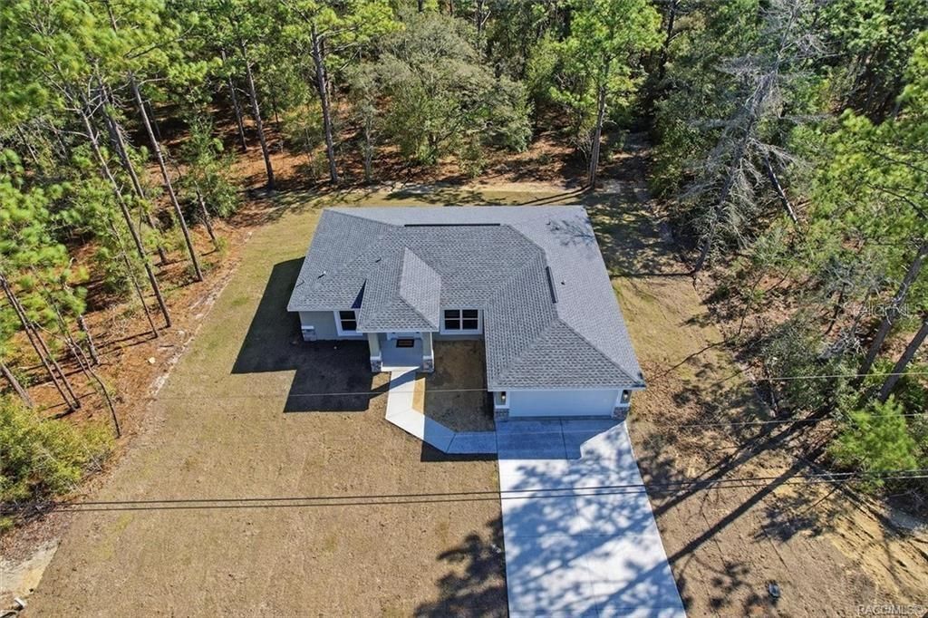 Photo of 7821 N Sarazen Drive, Citrus Springs, FL 34434 (MLS # TB8476701)